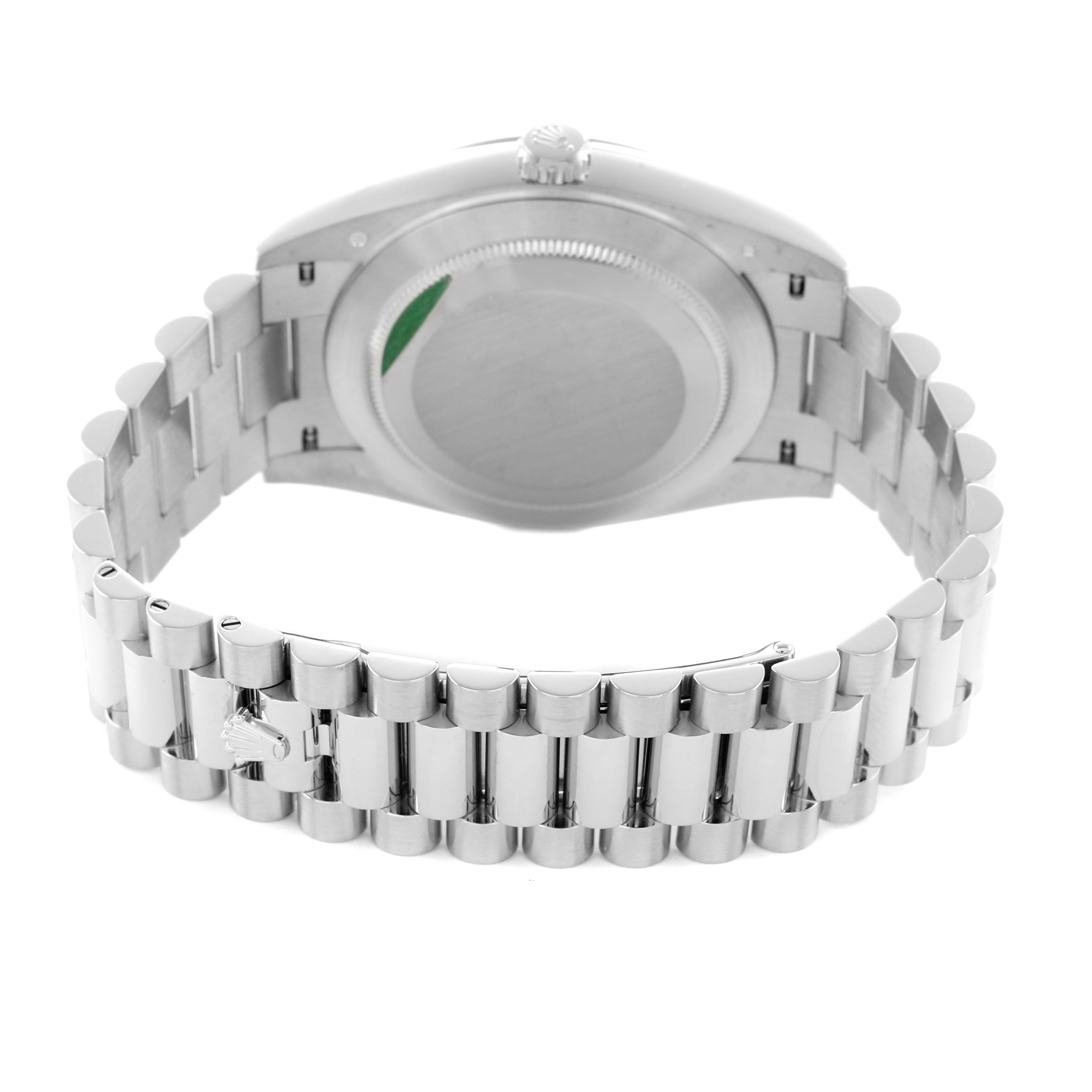 The Rolex President 228206 Men's Platinum Green Dial model watch is shown from the back, highlighting its case, bracelet, and clasp.