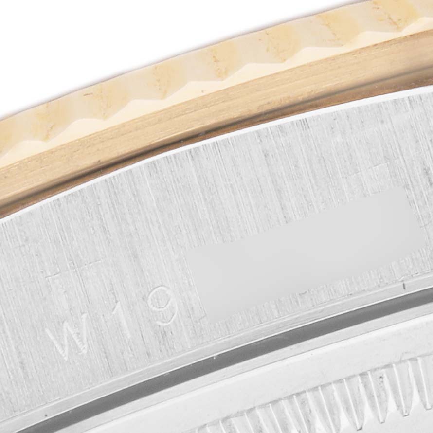 The image shows a close-up of the side of a Rolex President 18239 Men's Steel and Gold (two tone) Champagne Dial model, highlighting the bezel and part of the case.