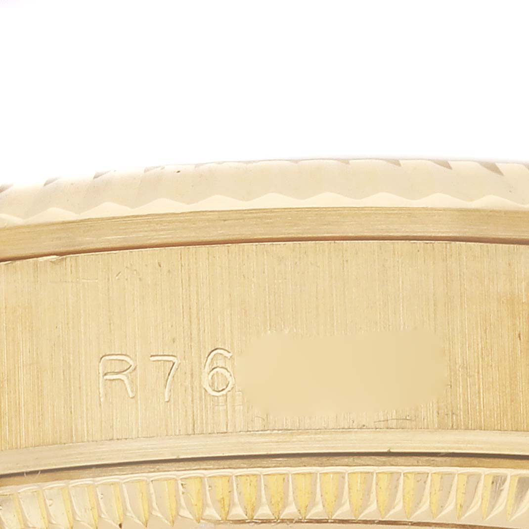 The image shows a close-up of the case edge and engraved serial of the Rolex President 68278 Women's Yellow Gold Champagne Dial model.