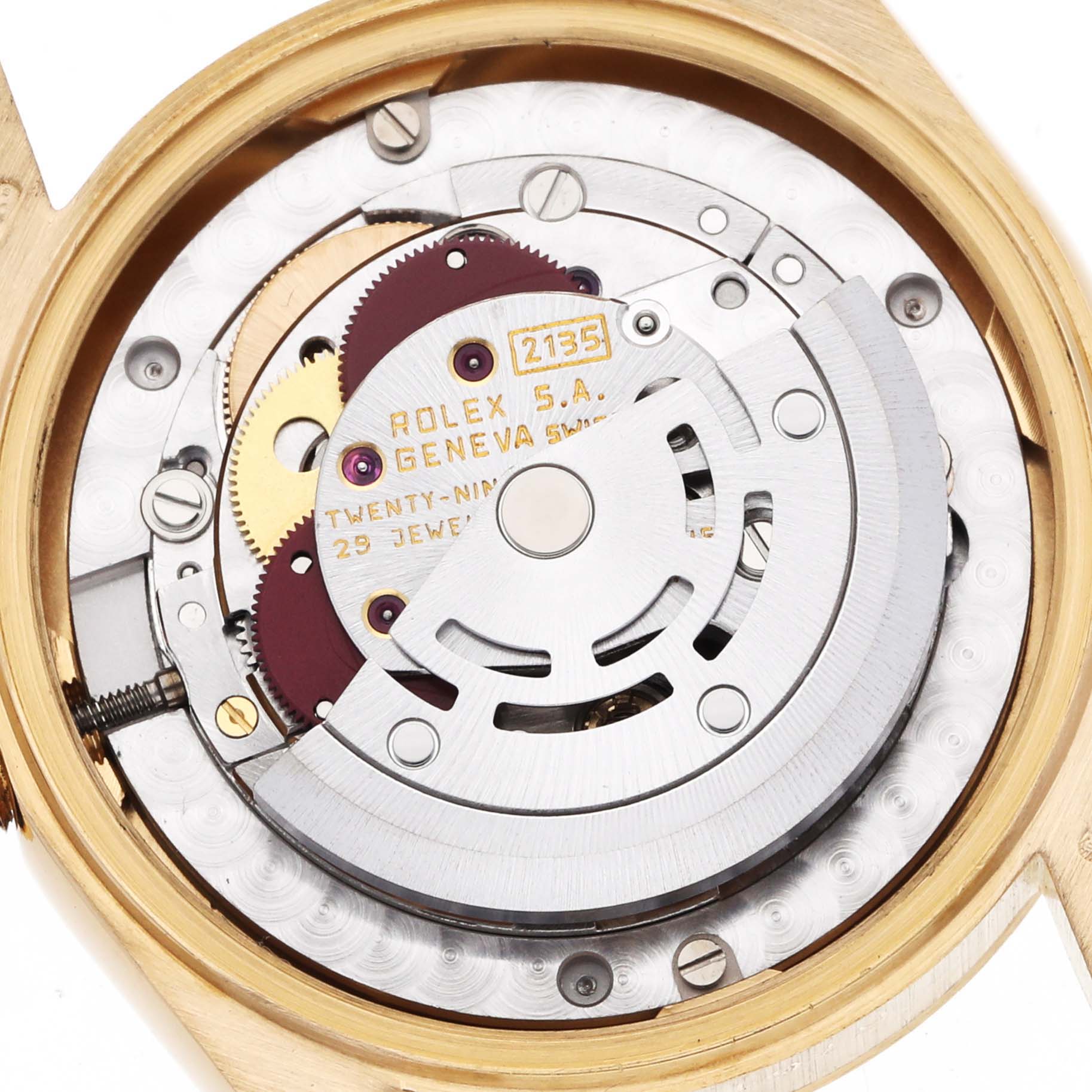 The image shows the inner movement of a Rolex President 68278 Women's Yellow Gold Champagne Dial watch, highlighting gears and the rotor from a top-down angle.