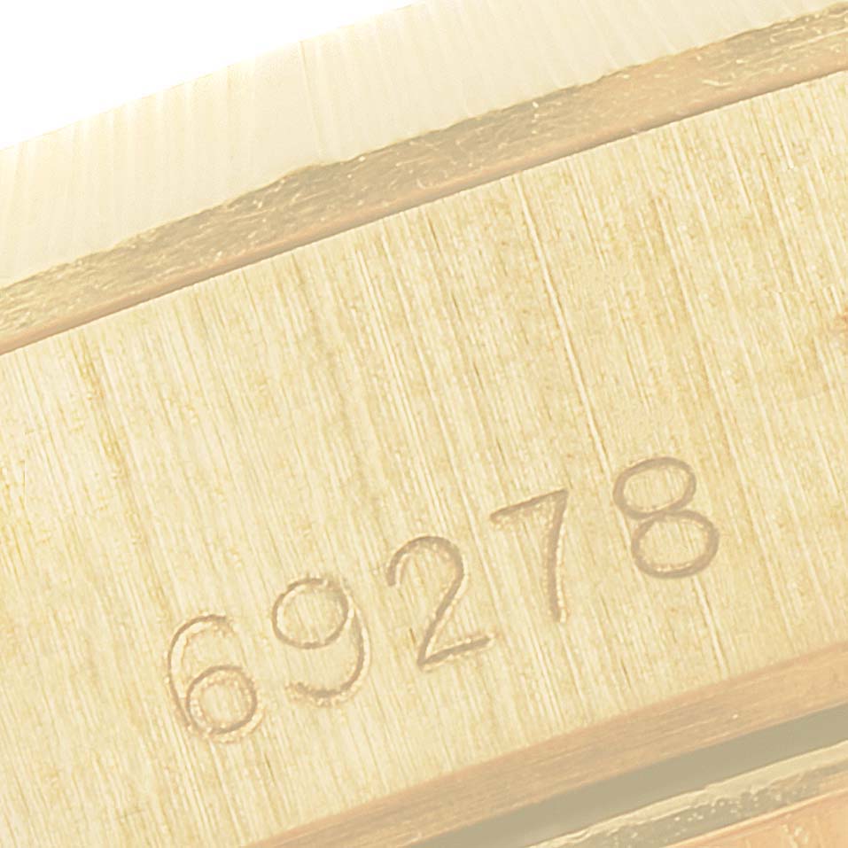 This close-up image shows part of the case with a visible reference number for the Rolex President 69278 Women's Yellow Gold Blue Dial 69278 Women's Yellow Gold Blue Dial model watch.