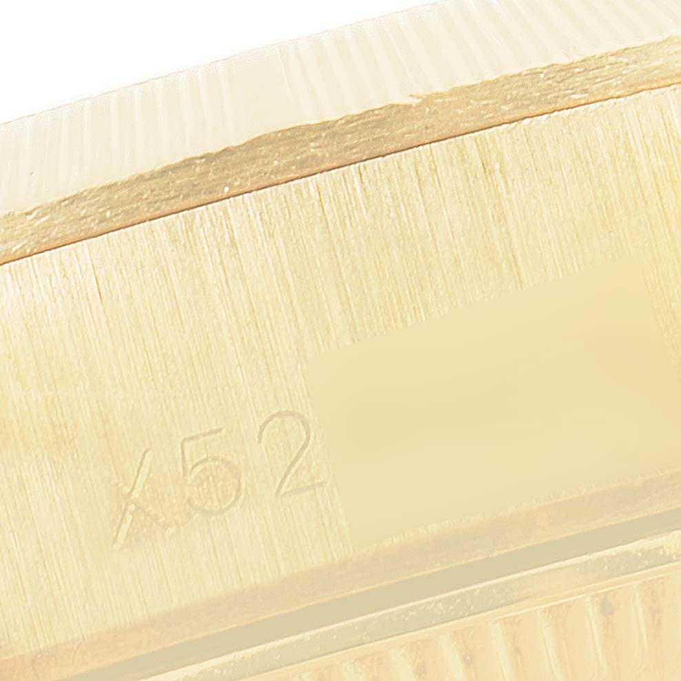 This close-up image shows the case side and edge of the bezel with engraved details of the Rolex President 69278 Women's Yellow Gold Blue Dial 69278 Women's Yellow Gold Blue Dial model watch.