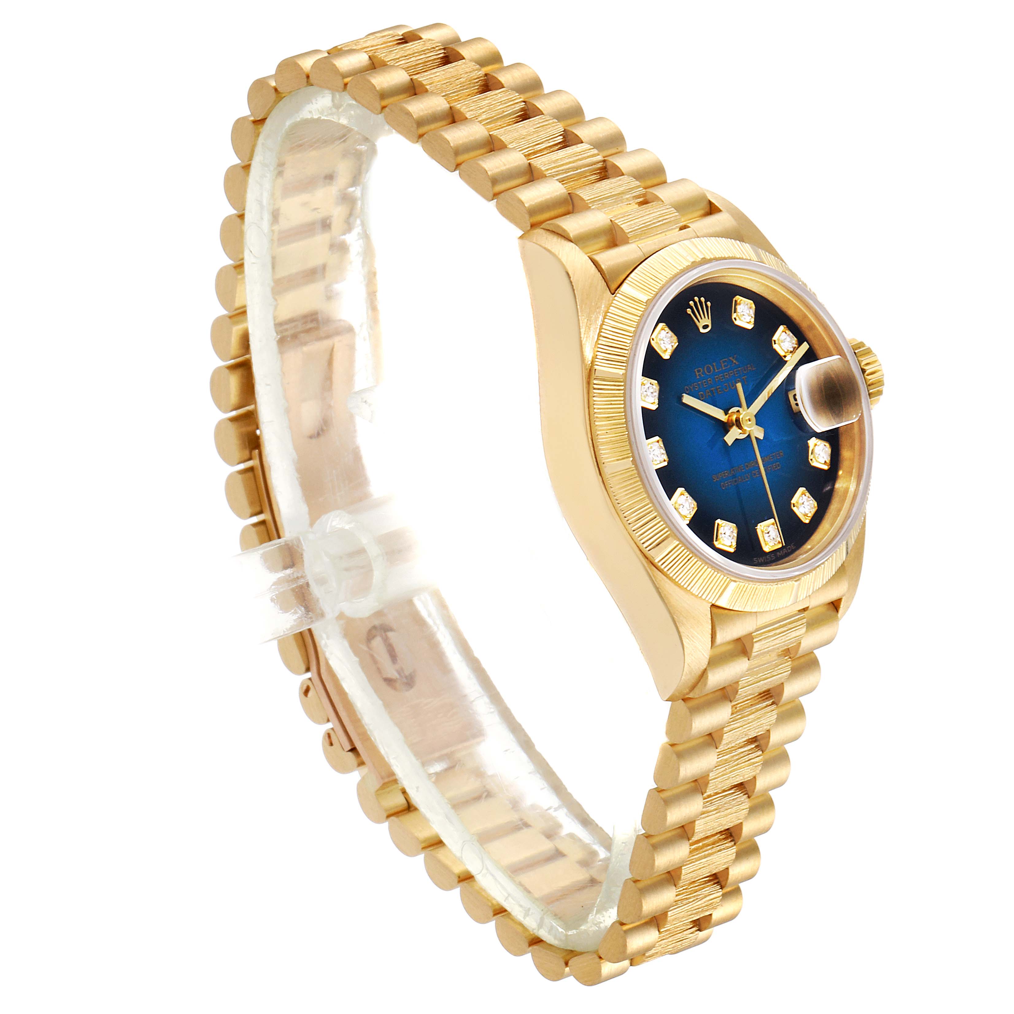 The image shows a Rolex President 69278 Women's Yellow Gold Blue Dial 69278 Women's Yellow Gold Blue Dial model watch with a gold bracelet and blue dial, viewed from an angled side perspective.