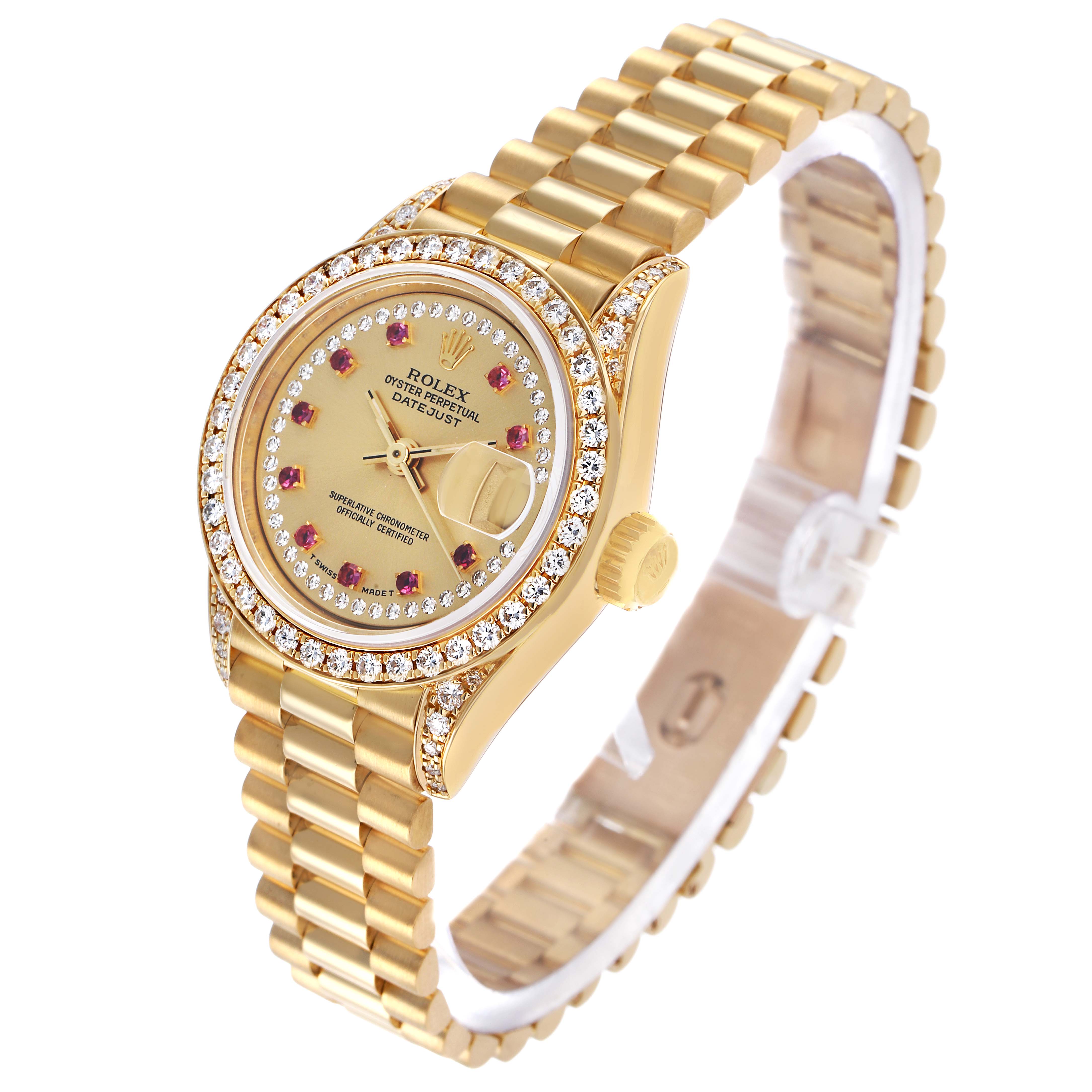 The Rolex President 69158 Women's Yellow Gold Champagne Dial model is shown at a three-quarter angle, highlighting its gold bracelet, diamond bezel, and dial with ruby markers.