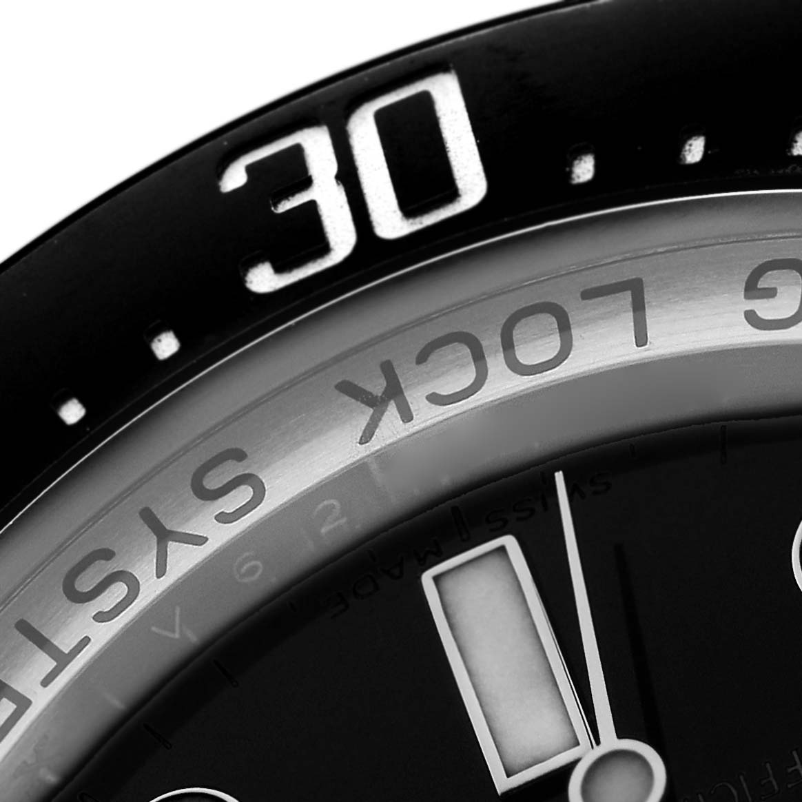 The image shows a close-up of the bezel and dial of a Rolex Sea-Dweller 116660 Men's Stainless Steel Black Dial, highlighting the 30-minute marker and "RING LOCK SYSTEM" text.
