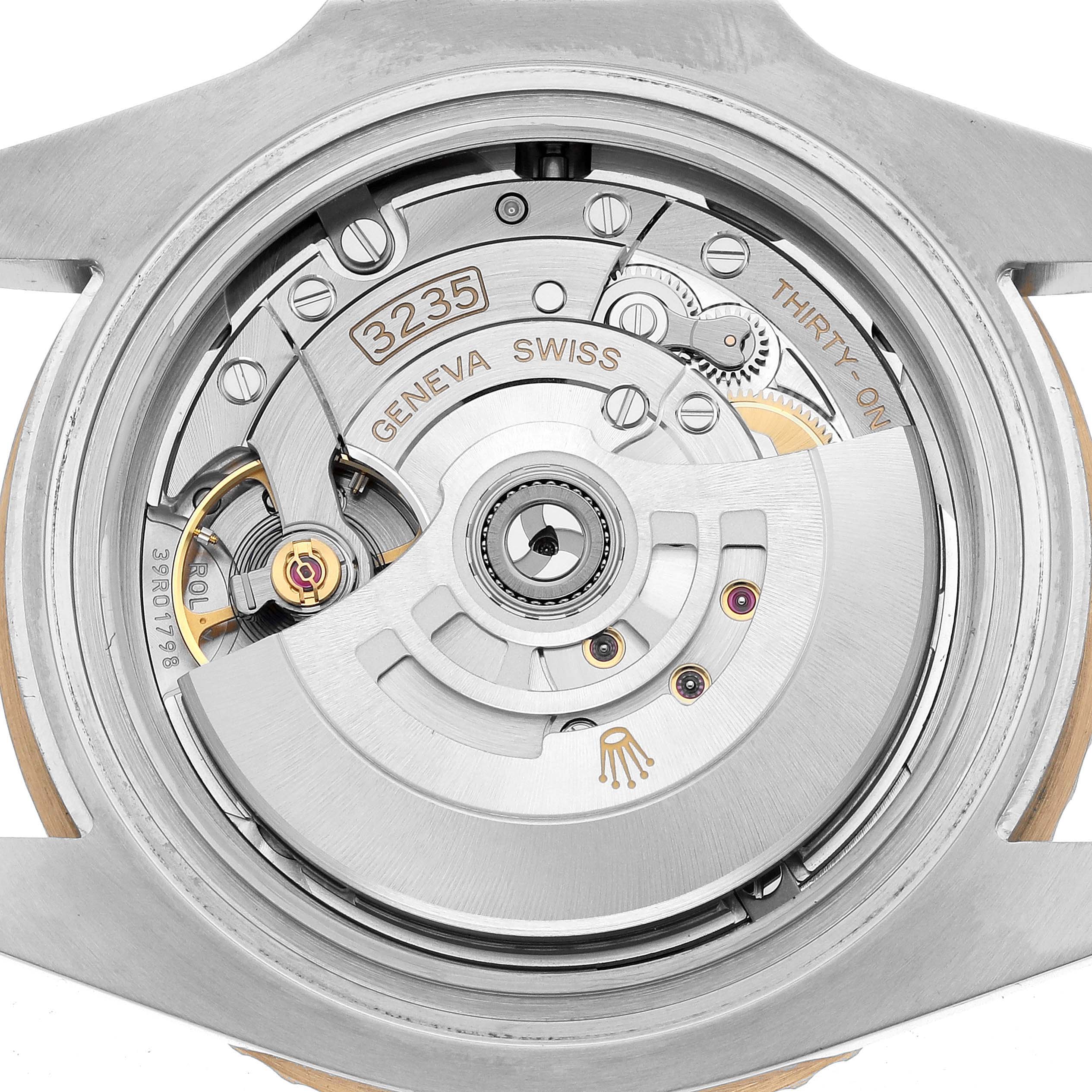 The image shows the Rolex Submariner 126613 Men's Steel and Gold (two tone) Black Dial's movement, viewed from the back, highlighting its intricate mechanical components.