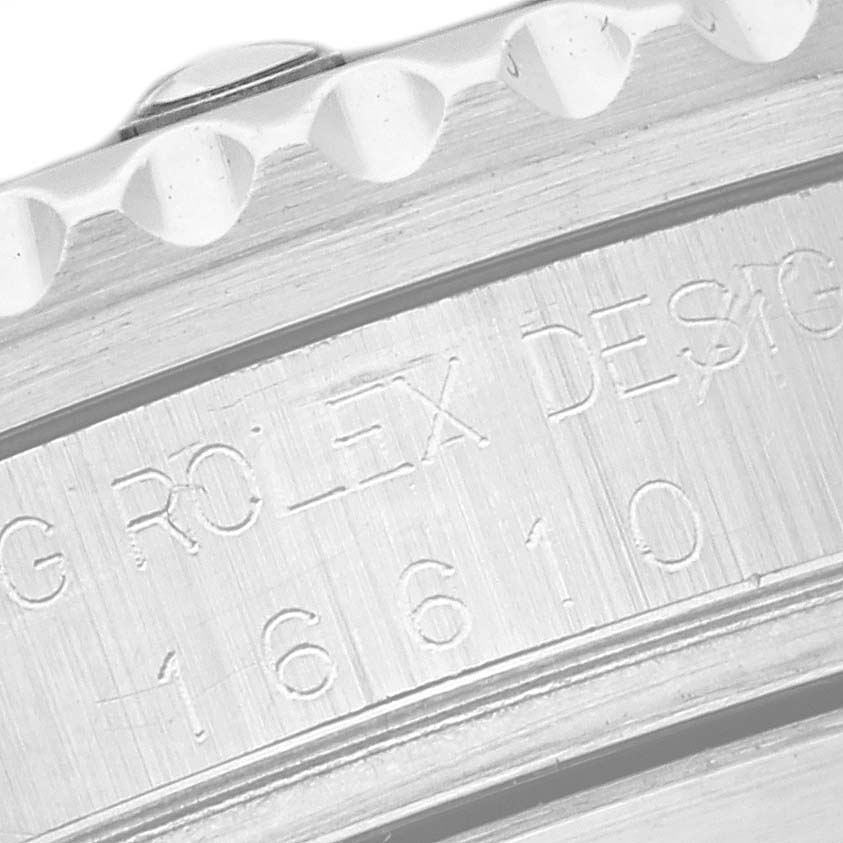This image shows a close-up of the side engraving on a Rolex Submariner 16610 Men
s Stainless Steel Black Dial 16610 Men
s Stainless Steel Black Dial model, revealing the model number.