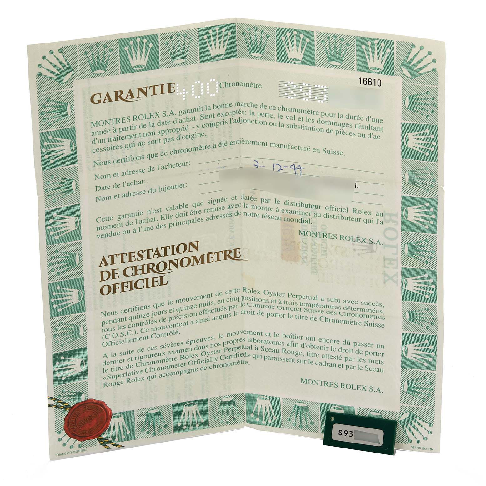 The image shows the official warranty papers and documentation for the Rolex Submariner 16610 Men
s Stainless Steel Black Dial 16610 Men
s Stainless Steel Black Dial model.