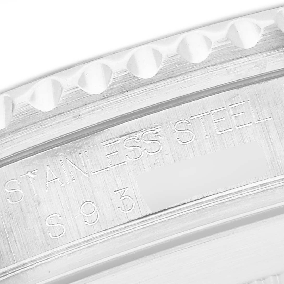 The image shows a close-up of the engraved stainless steel bezel of a Rolex Submariner 16610 Men
s Stainless Steel Black Dial 16610 Men
s Stainless Steel Black Dial.