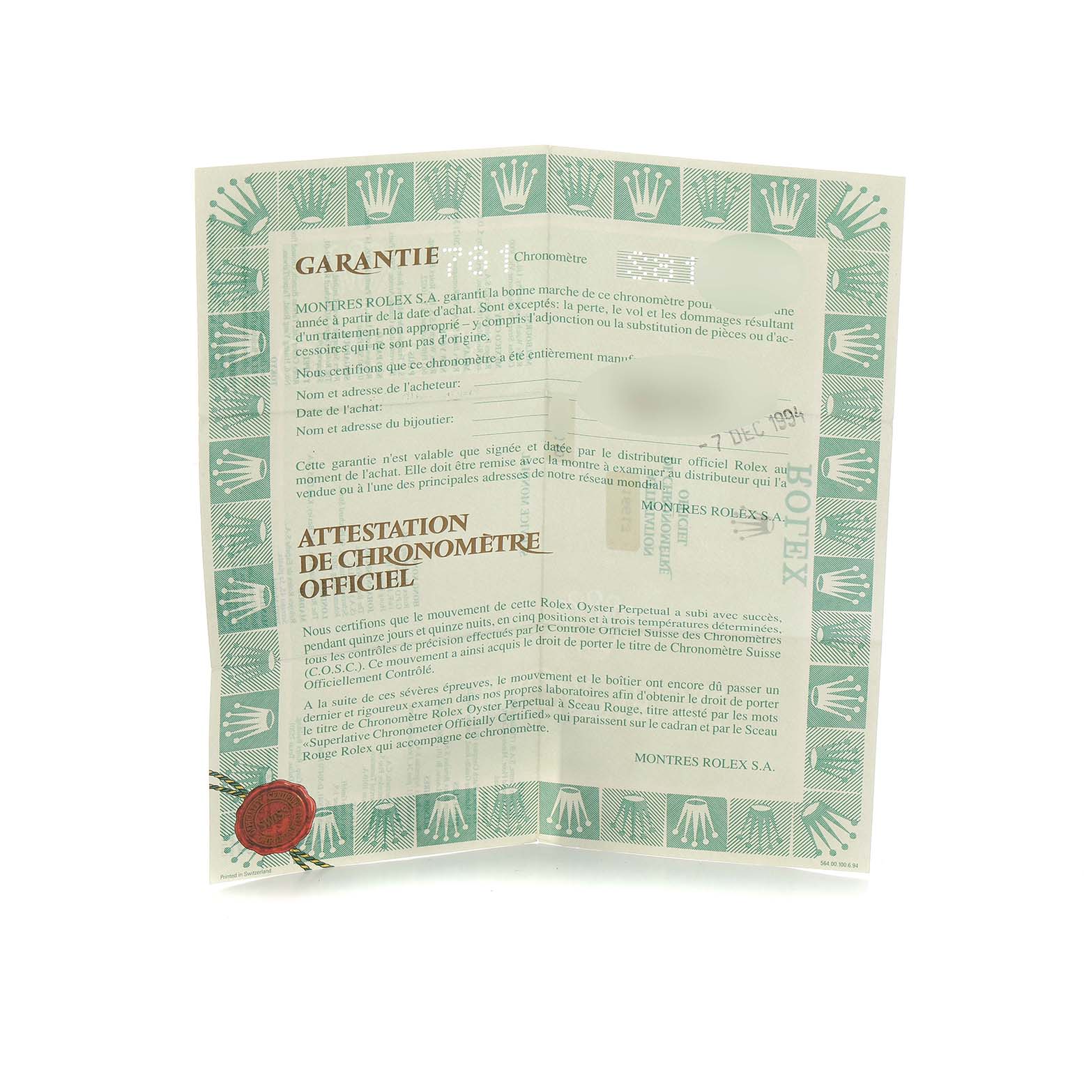 The image shows a warranty certificate for the Rolex Submariner 16613 Men's Steel and Gold (two tone) Blue Dial, featuring the brand's logo and official text.