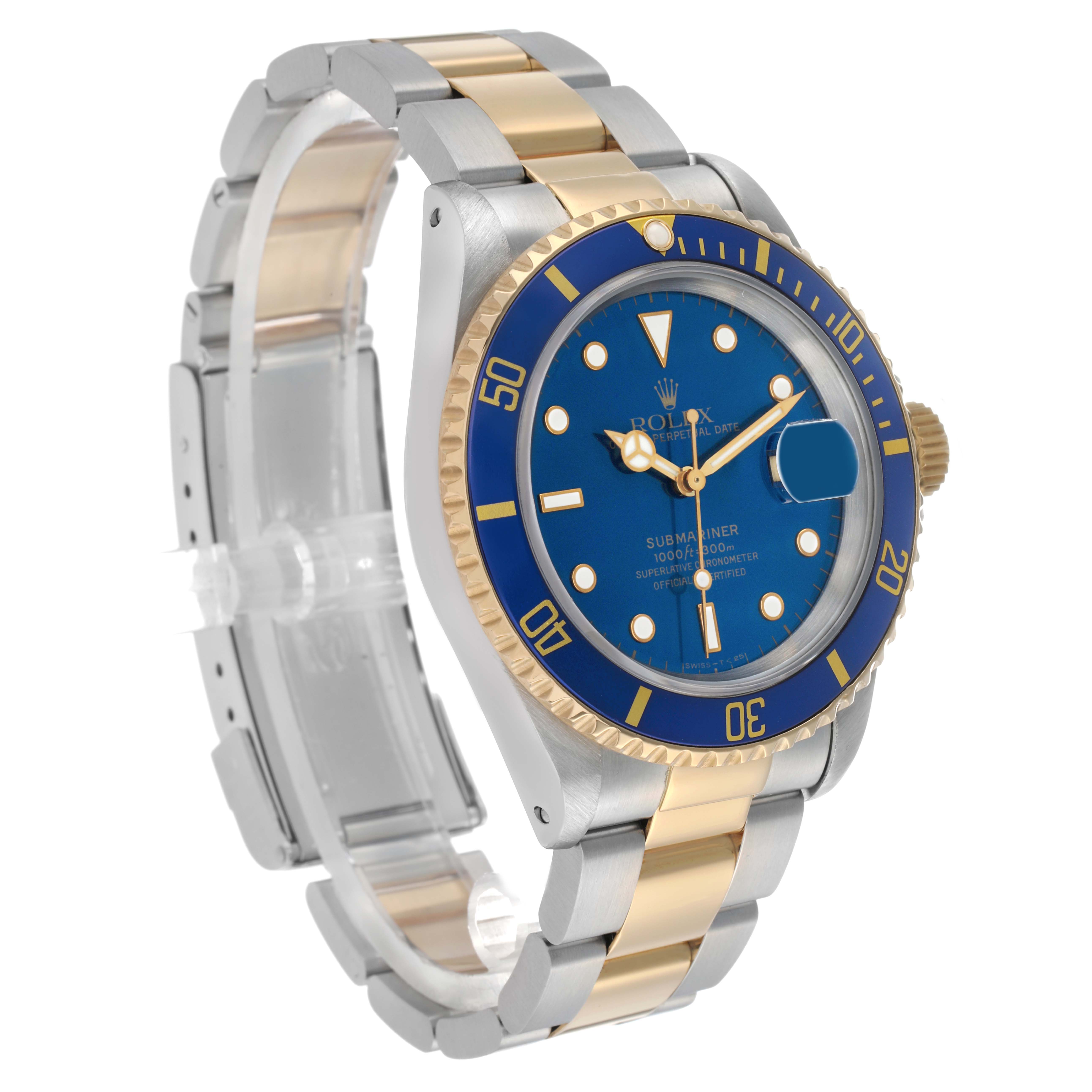 The Rolex Submariner 16613 Men's Steel and Gold (two tone) Blue Dial is shown at a three-quarter angle, highlighting the two-tone bracelet, blue dial, and gold bezel.