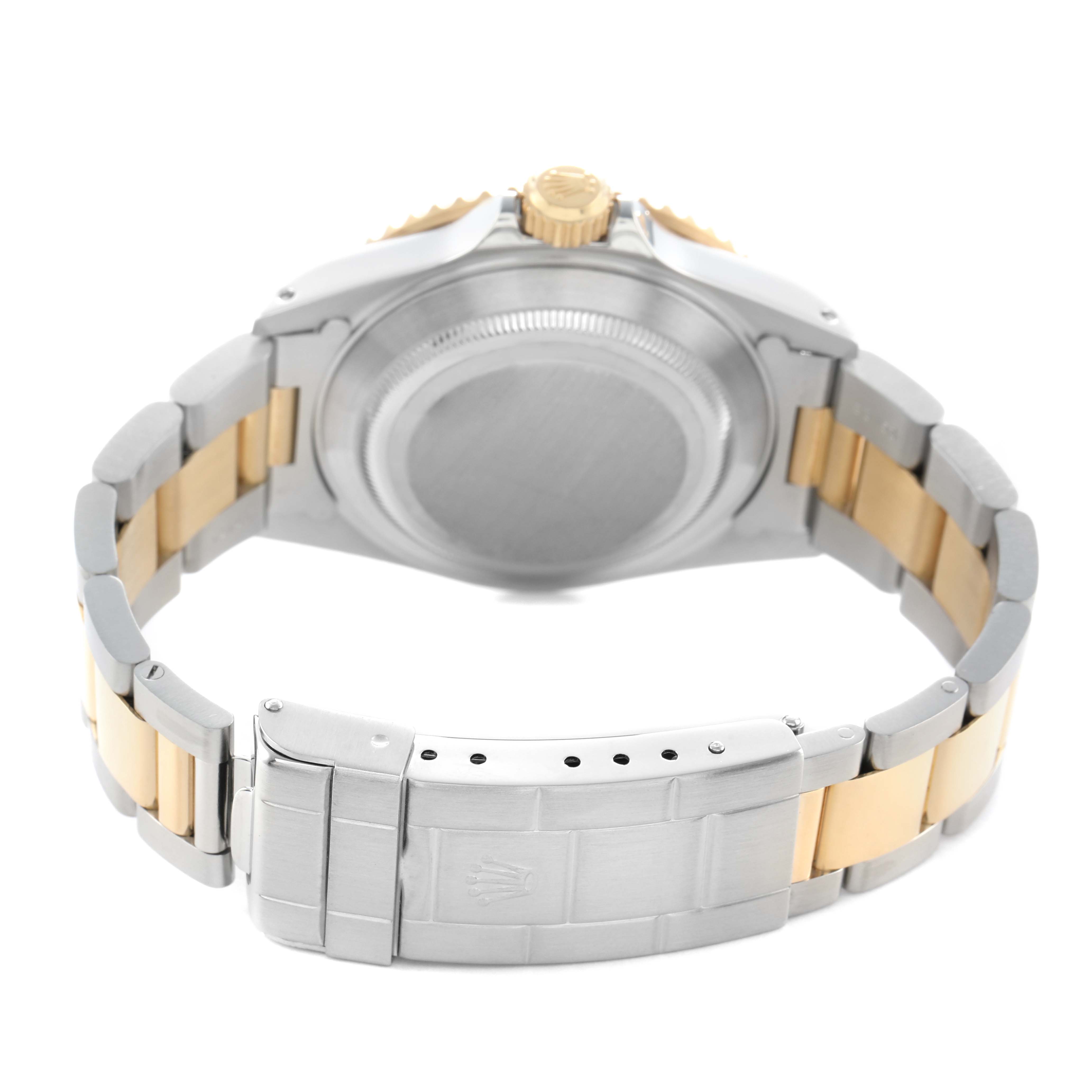 The image shows the back view of a Rolex Submariner 16613 Men's Steel and Gold (two tone) Blue Dial watch, highlighting the case back, bracelet, and clasp.