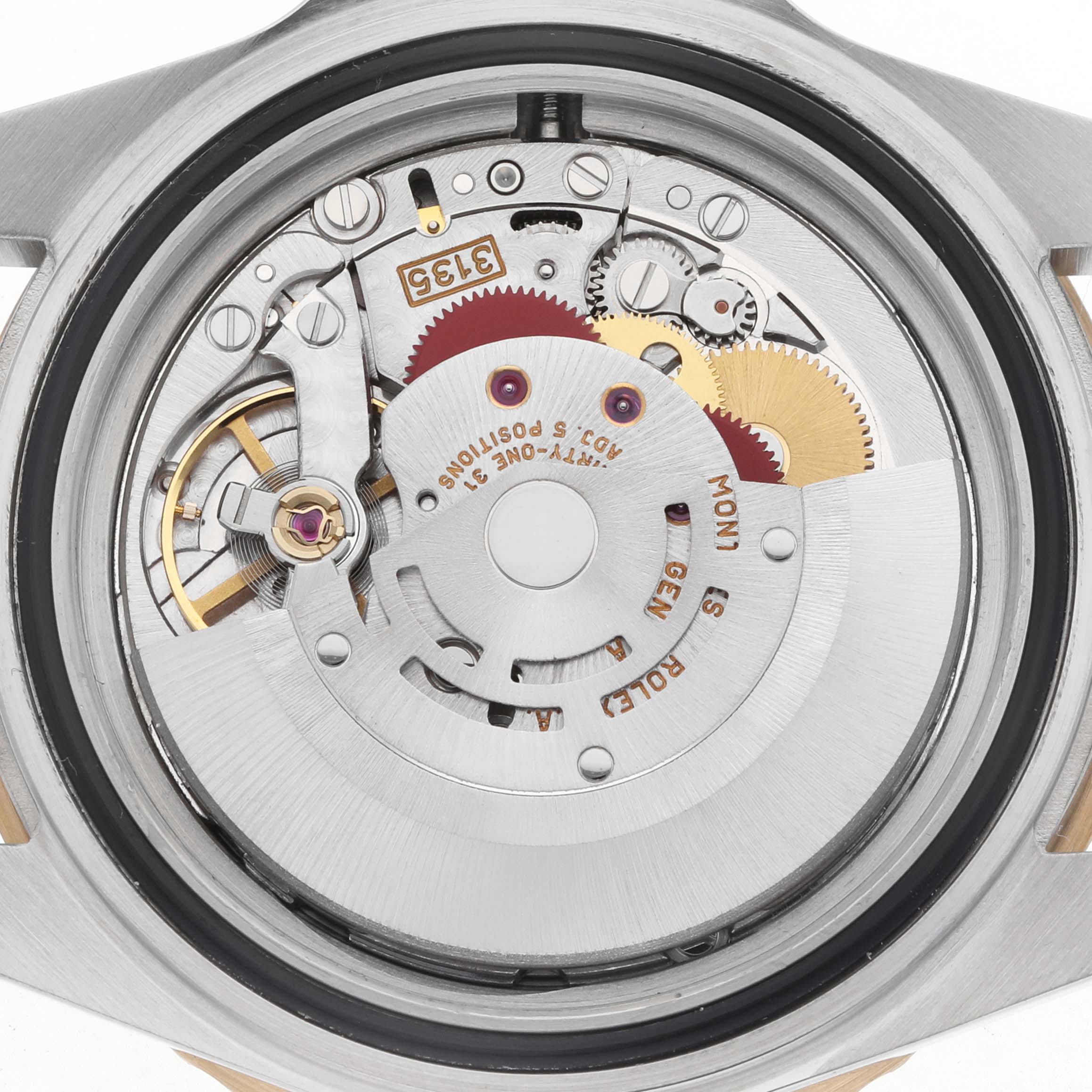 The image shows the movement components of the Rolex Submariner 16613 Men's Steel and Gold (two tone) Blue Dial, viewed from the back, highlighting gears and mechanical parts.