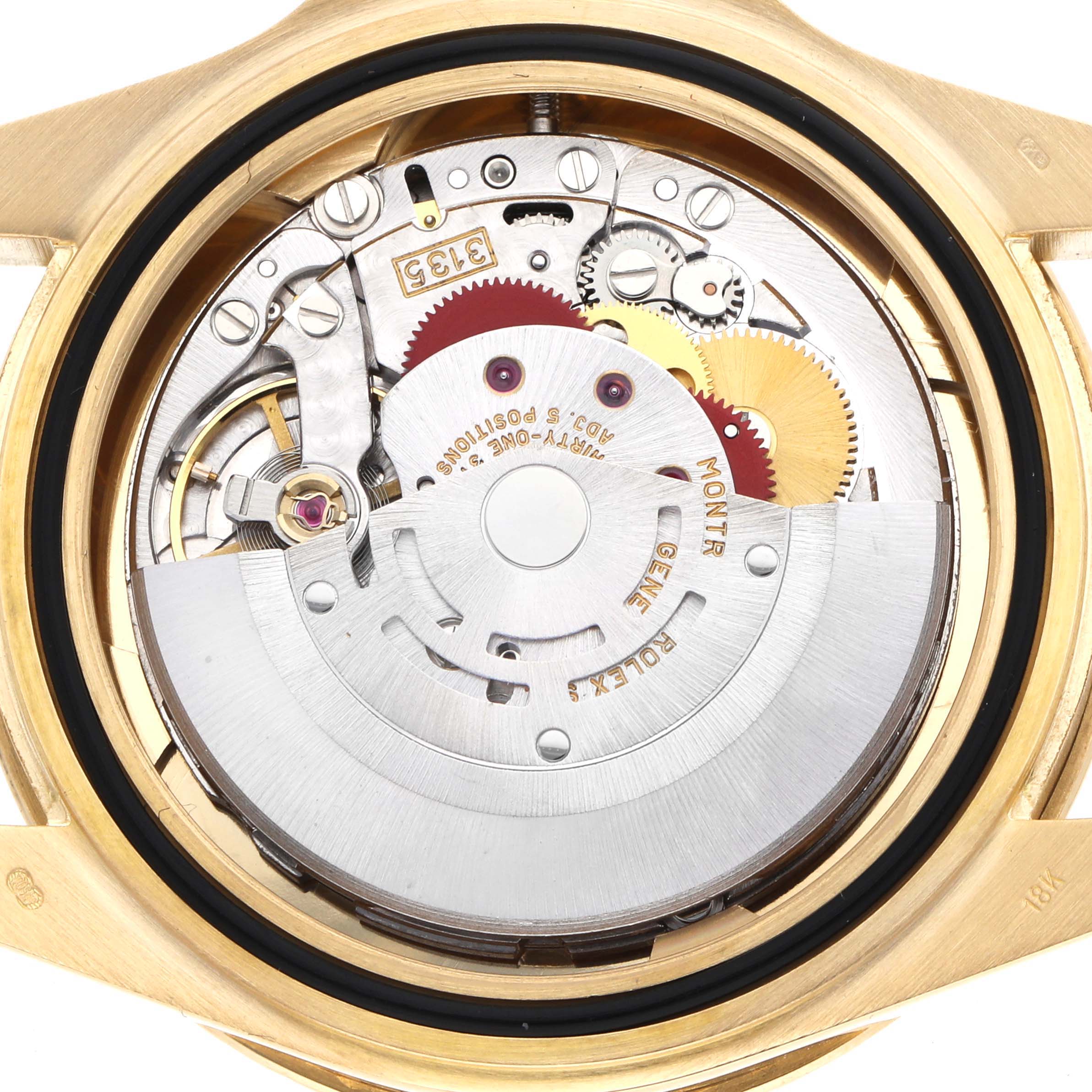 The image shows the Rolex Yacht-Master 16628B Men's Yellow Gold White Dial's movement from the back, highlighting gears and the rotor mechanism.