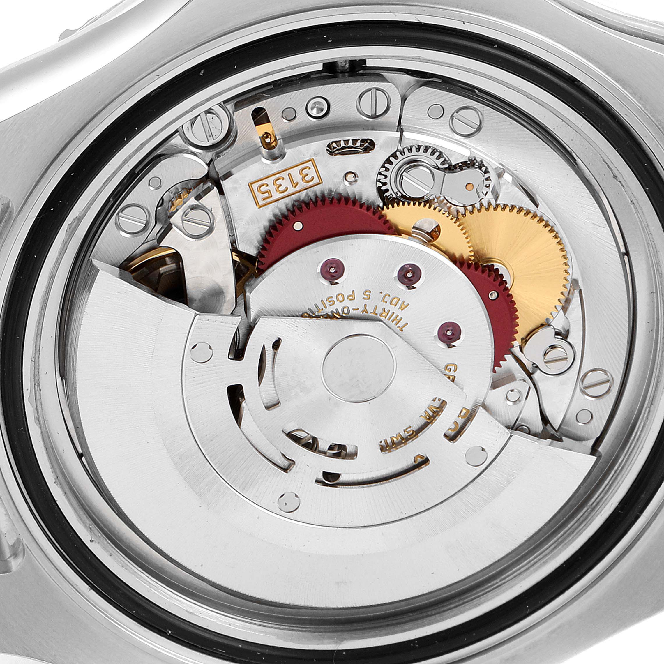 The image shows a close-up of the internal movement mechanism of the Rolex Yacht-Master 116622 Men
s Stainless Steel Grey Dial 116622 Men
s Stainless Steel Grey Dial watch, highlighting gears and components.