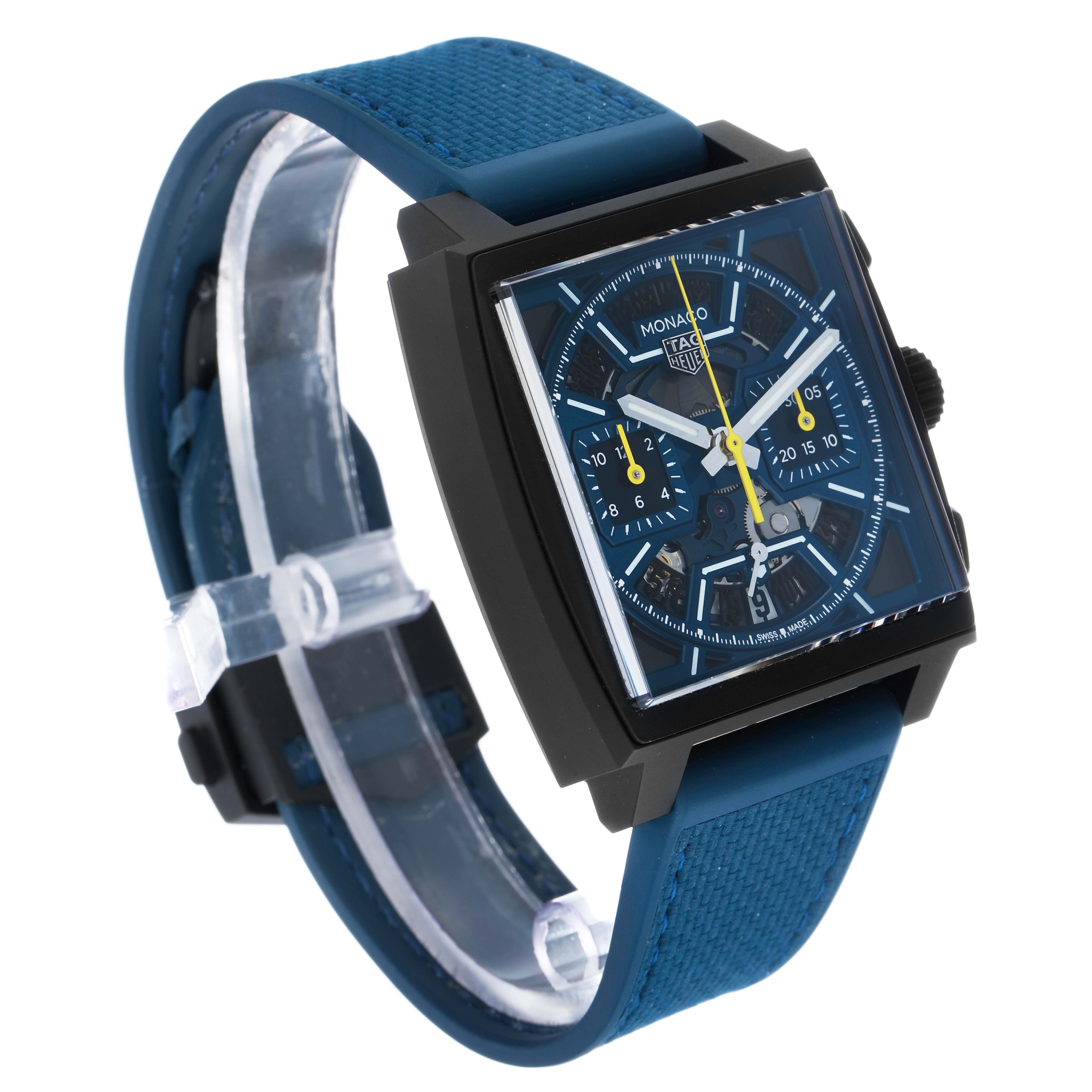 The Tag Heuer Monaco CBL2188.FT6261 Men's Titanium Blue Dial watch is shown at an angle highlighting its square face, blue strap, and chronograph details.
