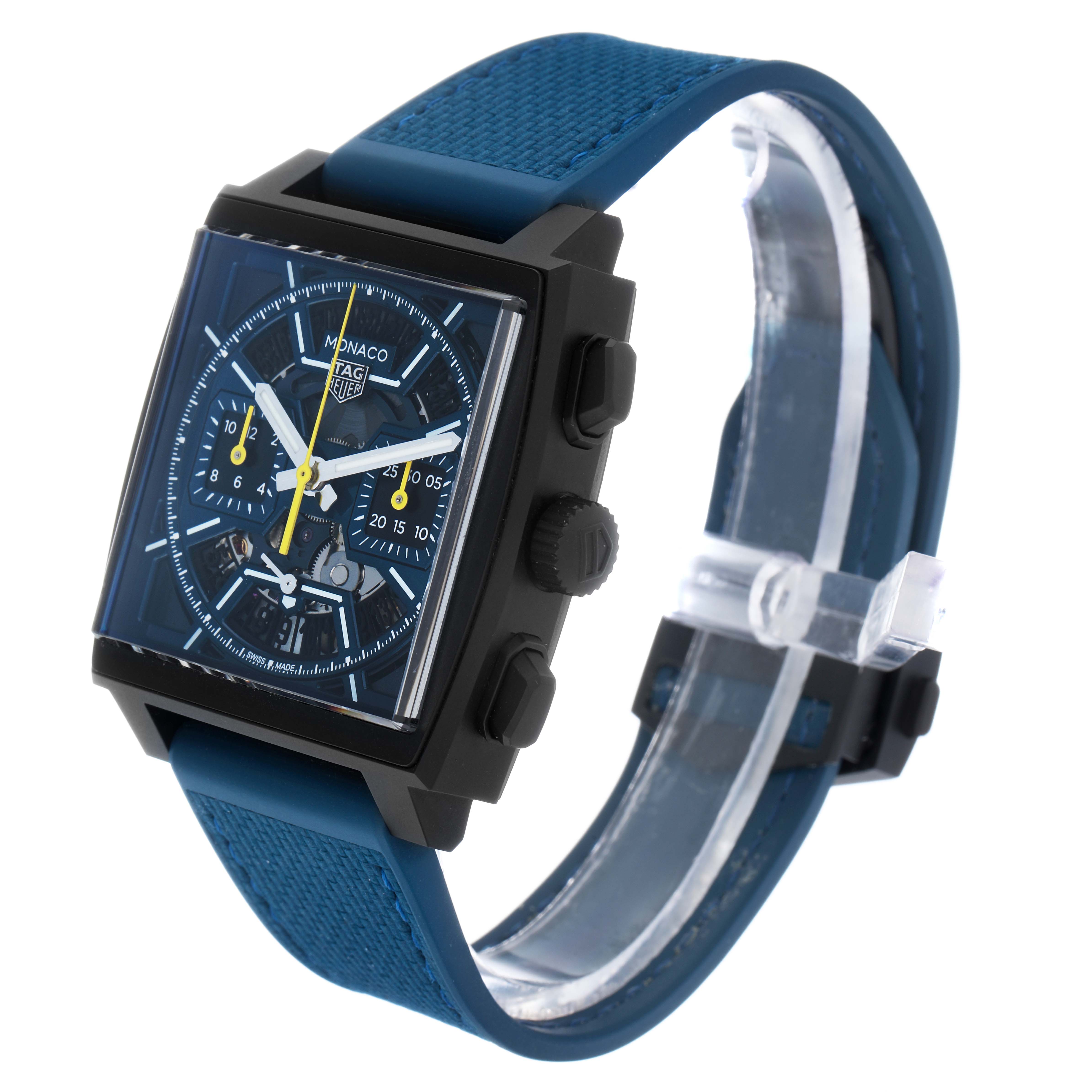 The Tag Heuer Monaco CBL2188.FT6261 Men's Titanium Blue Dial watch is shown at a front-side angle, displaying its face, buttons, and blue strap.