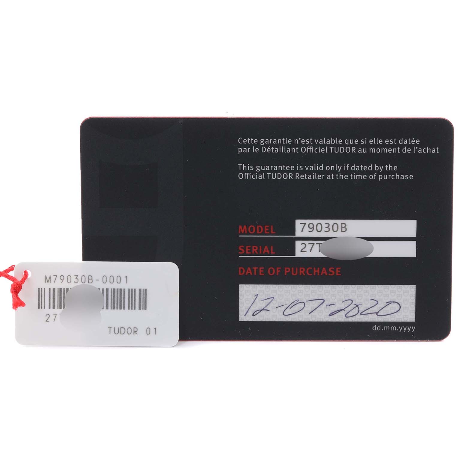 The image shows the warranty card and tag for a Tudor Heritage Black Bay 79030 Men's Stainless Steel Blue Dial 79030 Men's Stainless Steel Blue Dial watch, displaying model and serial numbers.