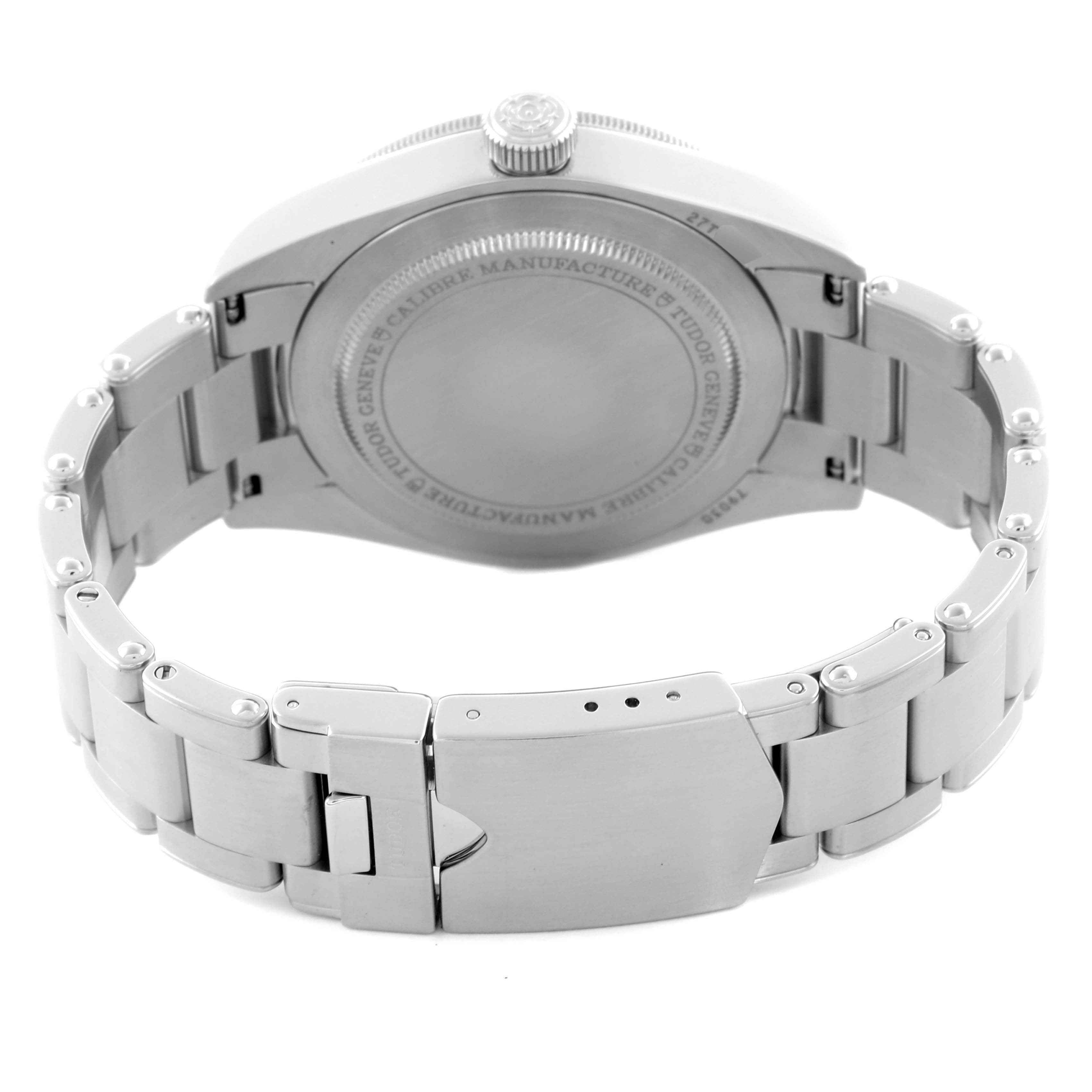 The image shows the back of a Tudor Heritage Black Bay 79030 Men's Stainless Steel Blue Dial 79030 Men's Stainless Steel Blue Dial watch and its stainless steel bracelet in a half-open position.