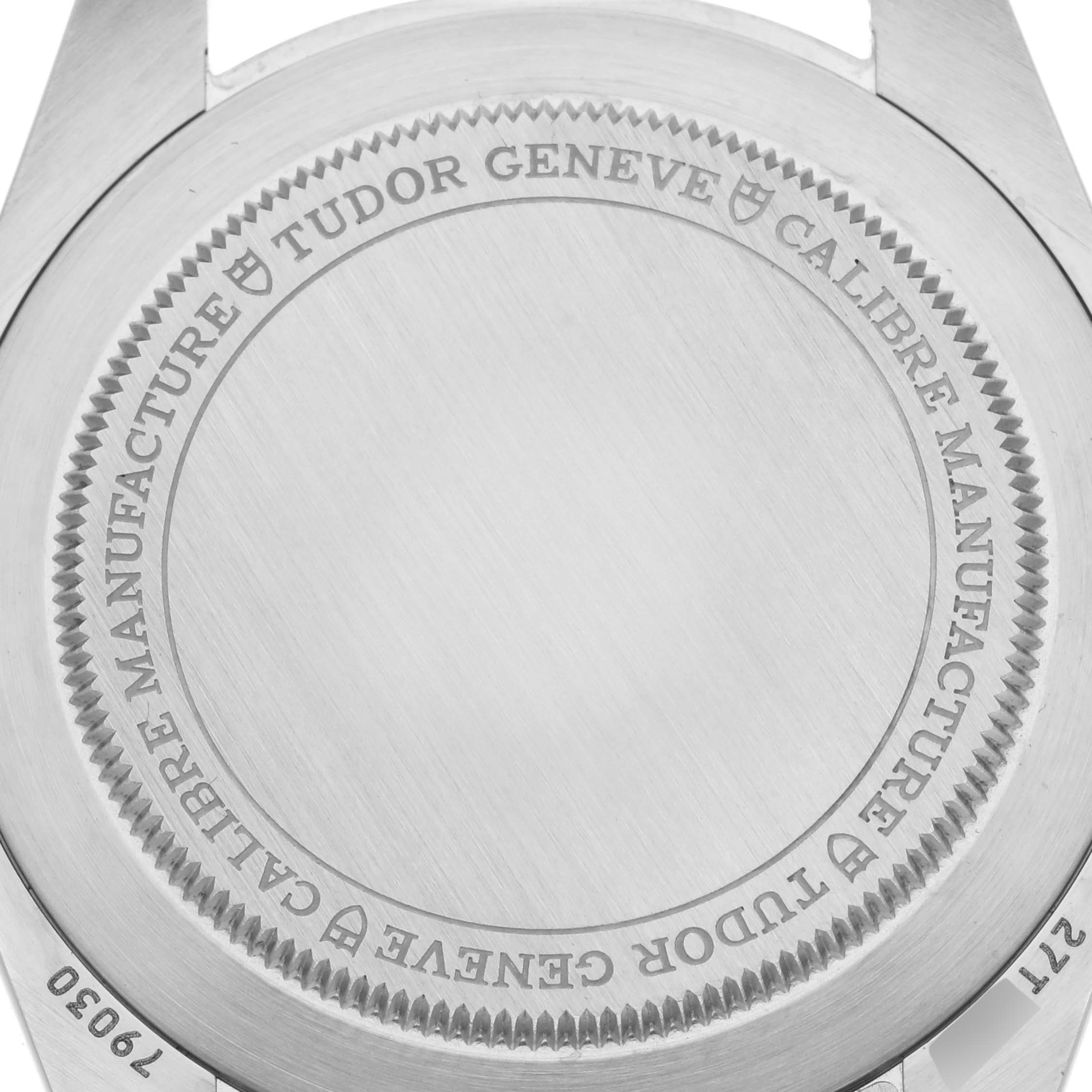 The image shows the back case of the Tudor Heritage Black Bay 79030 Men's Stainless Steel Blue Dial 79030 Men's Stainless Steel Blue Dial watch, displaying engraved text and brushed metal finish.