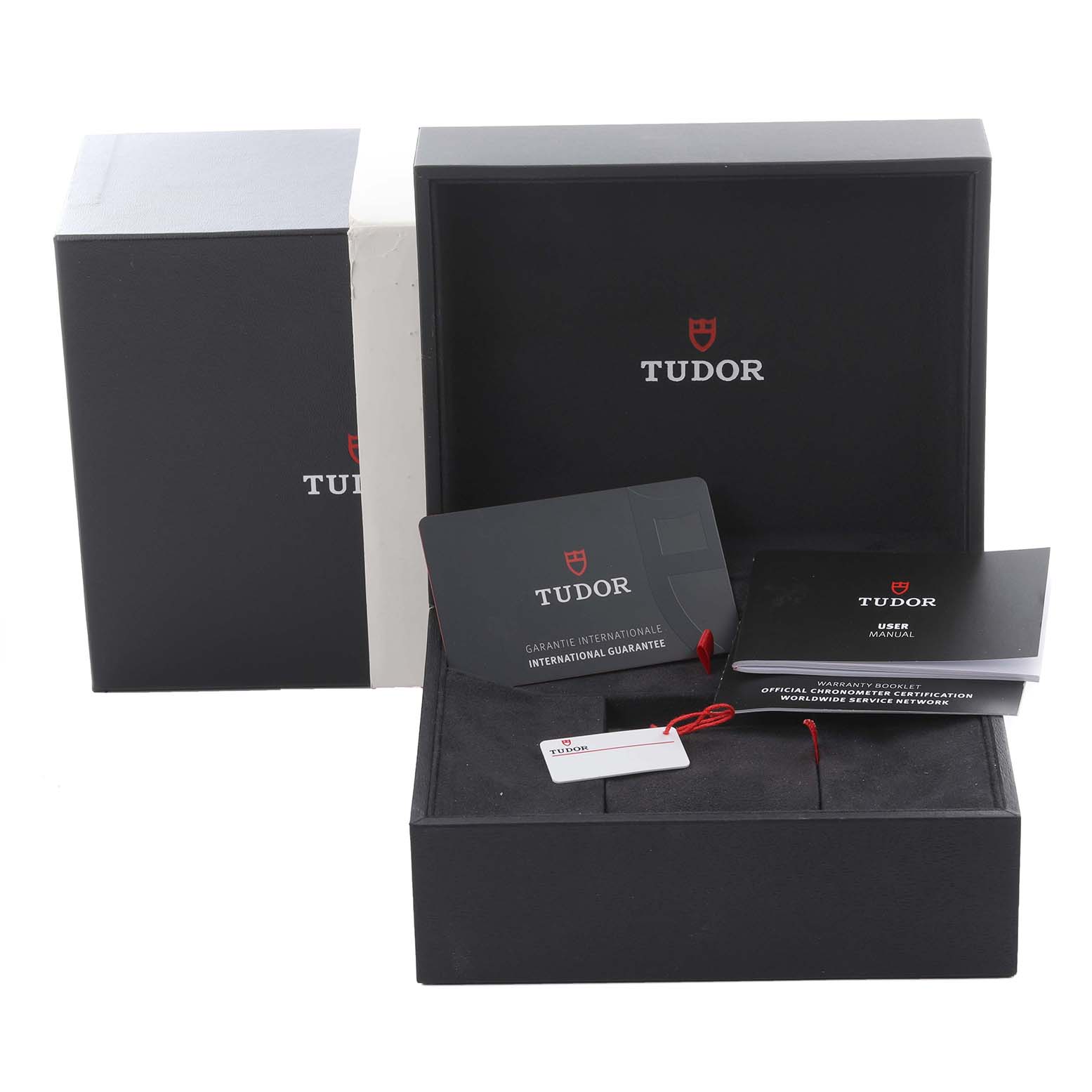 This image shows the packaging and accessories for a Tudor Heritage Black Bay 79030 Men's Stainless Steel Blue Dial 79030 Men's Stainless Steel Blue Dial, including boxes and documentation from a top angle.