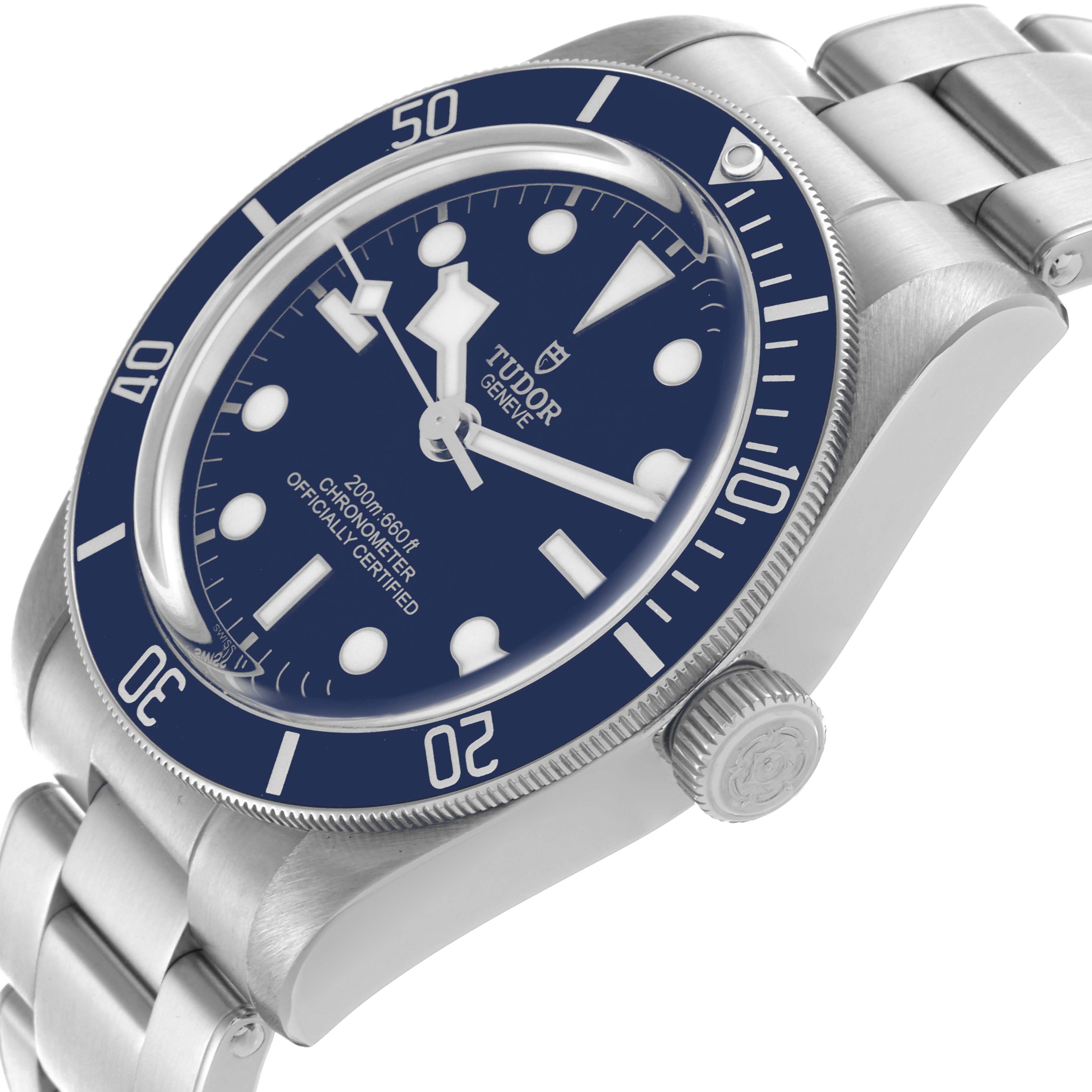 The Tudor Heritage Black Bay 79030 Men's Stainless Steel Blue Dial 79030 Men's Stainless Steel Blue Dial watch is shown at an angle displaying the dial, bezel, crown, and part of the bracelet.