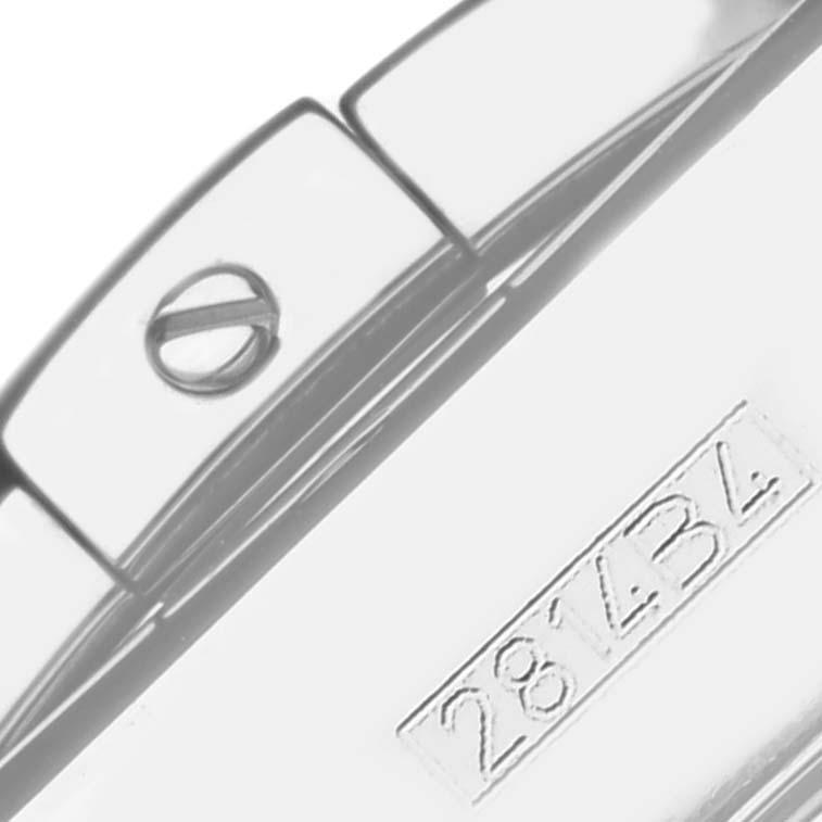 The image shows a close-up of the bracelet clasp and serial number of a Breitling Chronomat AB0115 Men
s Stainless Steel Silver Dial AB0115 Men
s Stainless Steel Silver Dial.