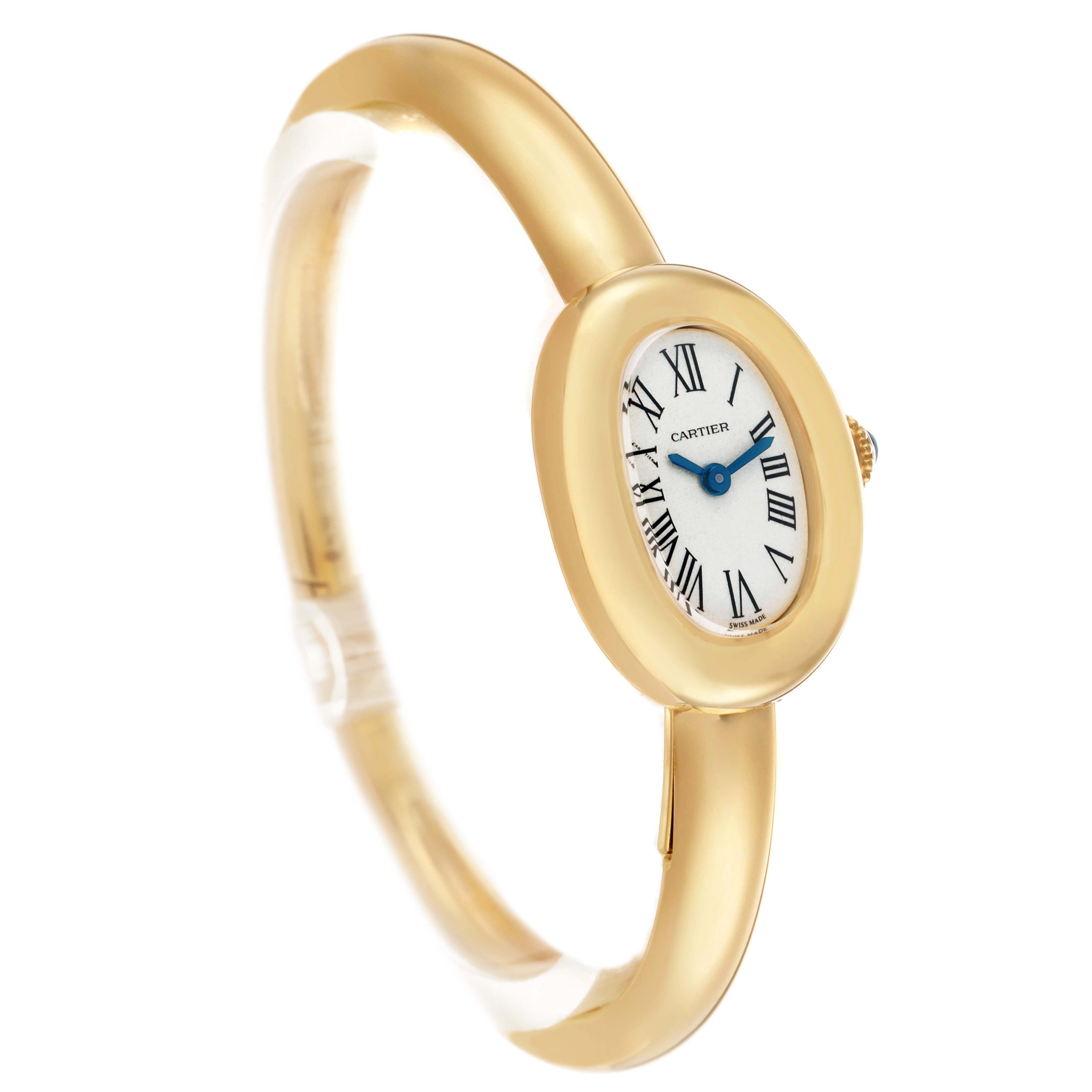 The Cartier Baignoire WGBA0044 Women's Yellow Gold Silver Dial watch is shown at a slight angle, highlighting its oval face, gold case, and bracelet.
