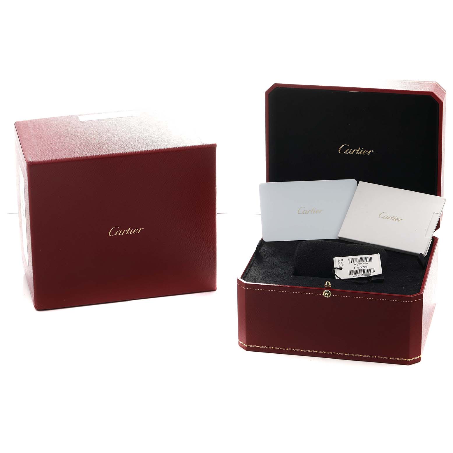The image shows the Cartier Baignoire WGBA0044 Women's Yellow Gold Silver Dial watch box and its contents, including documentation and packaging, from a front angle.