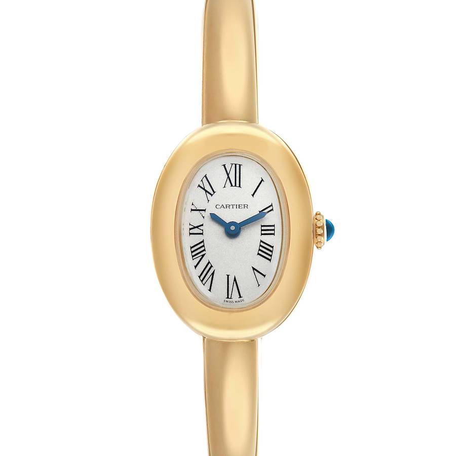 The Cartier Baignoire WGBA0044 Women's Yellow Gold Silver Dial watch is shown from a front angle, displaying its oval face, Roman numerals, and gold strap.