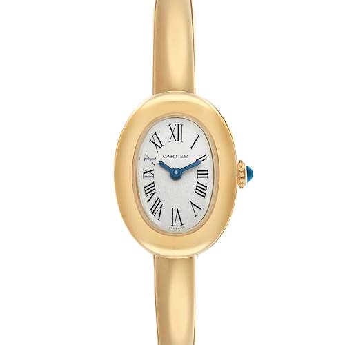 The Cartier Baignoire WGBA0044 Women
s Yellow Gold Silver Dial watch is shown from a top-down angle, displaying its oval face, Roman numerals, and gold bracelet.