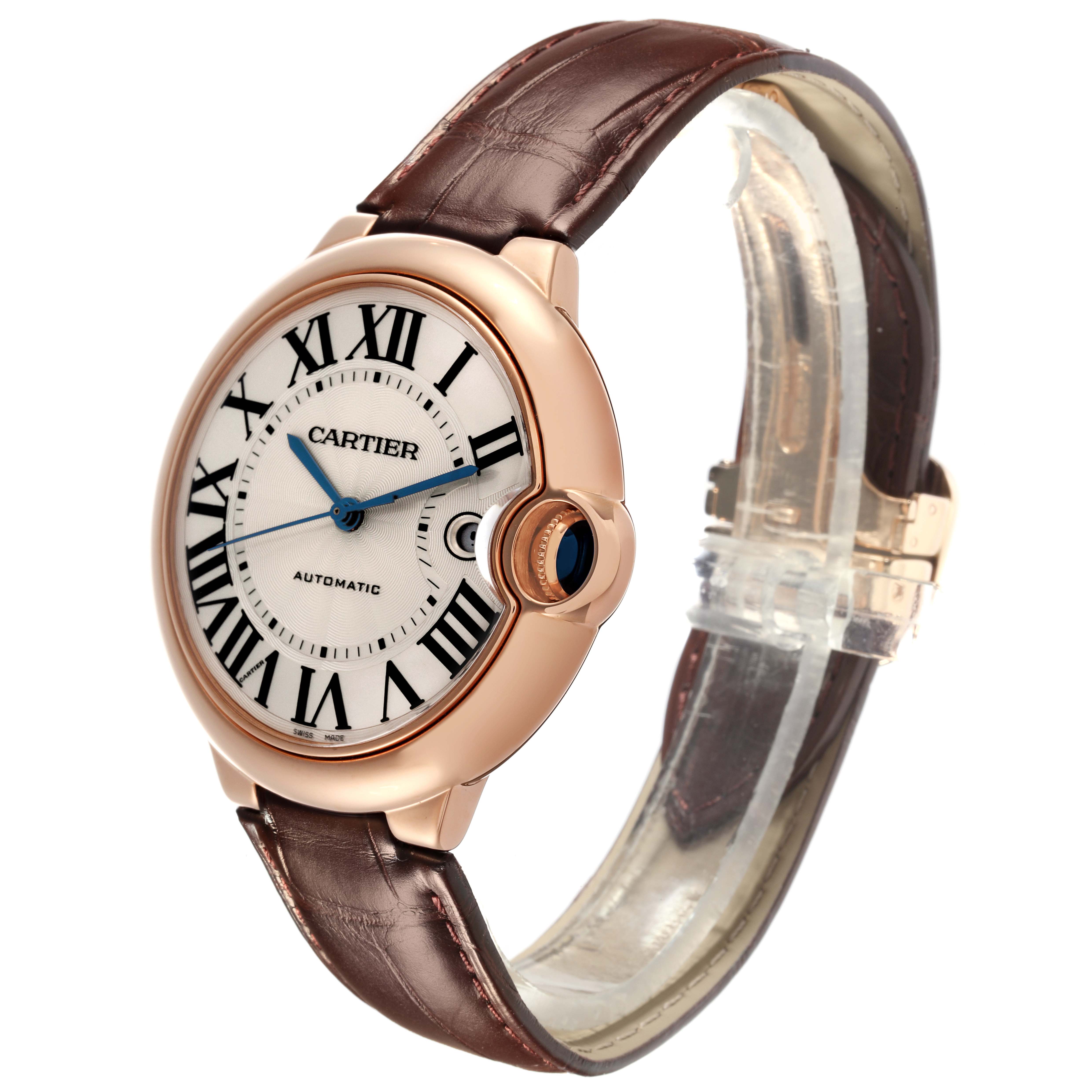 The Cartier Ballon Bleu W69000651 Men
s Rose Gold Silver Dial W69000651 Men
s Rose Gold Silver Dial watch is shown at a slight side angle, featuring its face, Roman numerals, blue hands, and brown strap.