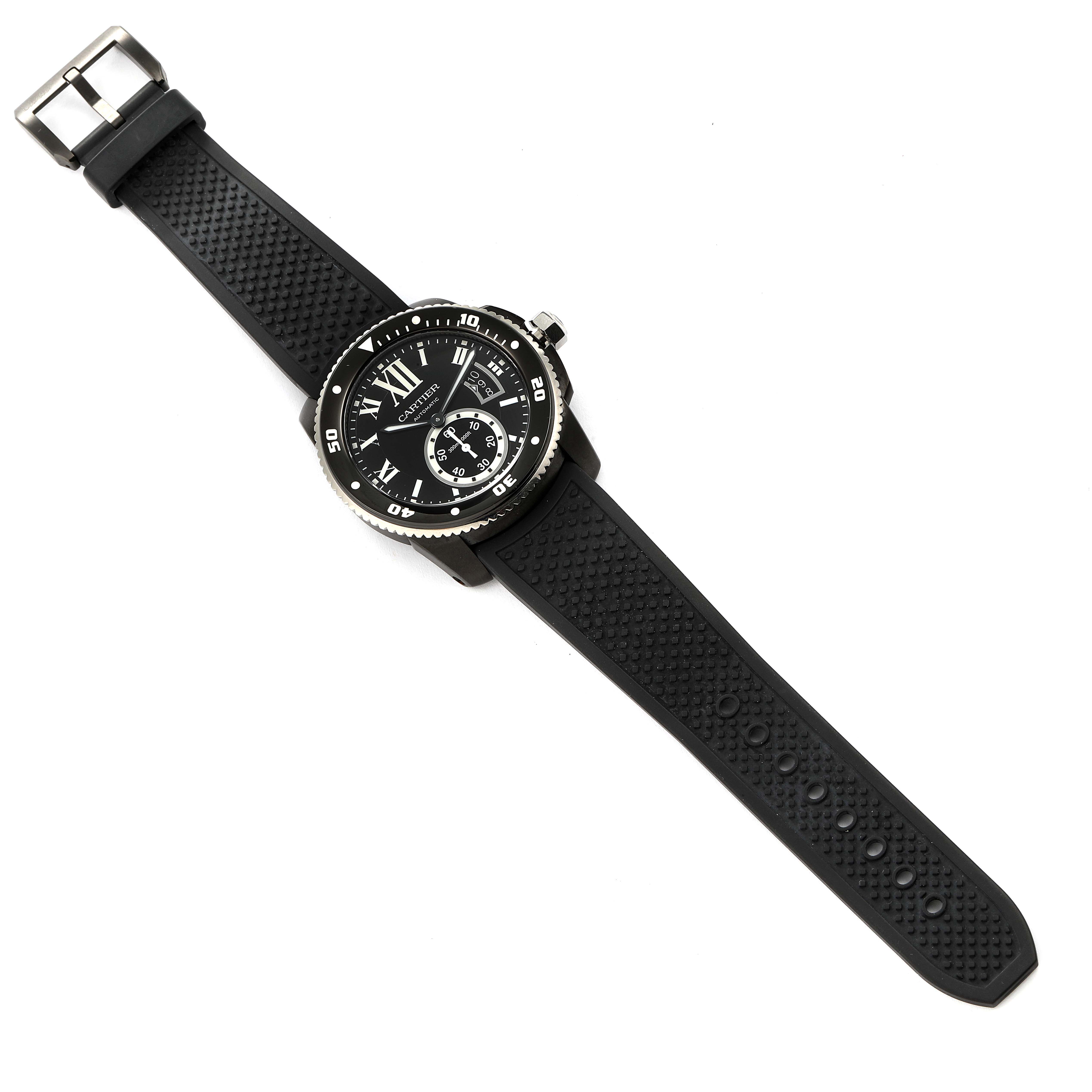 The Calibre de Cartier watch by Cartier is shown from a top-down angle, displaying its face and full strap.