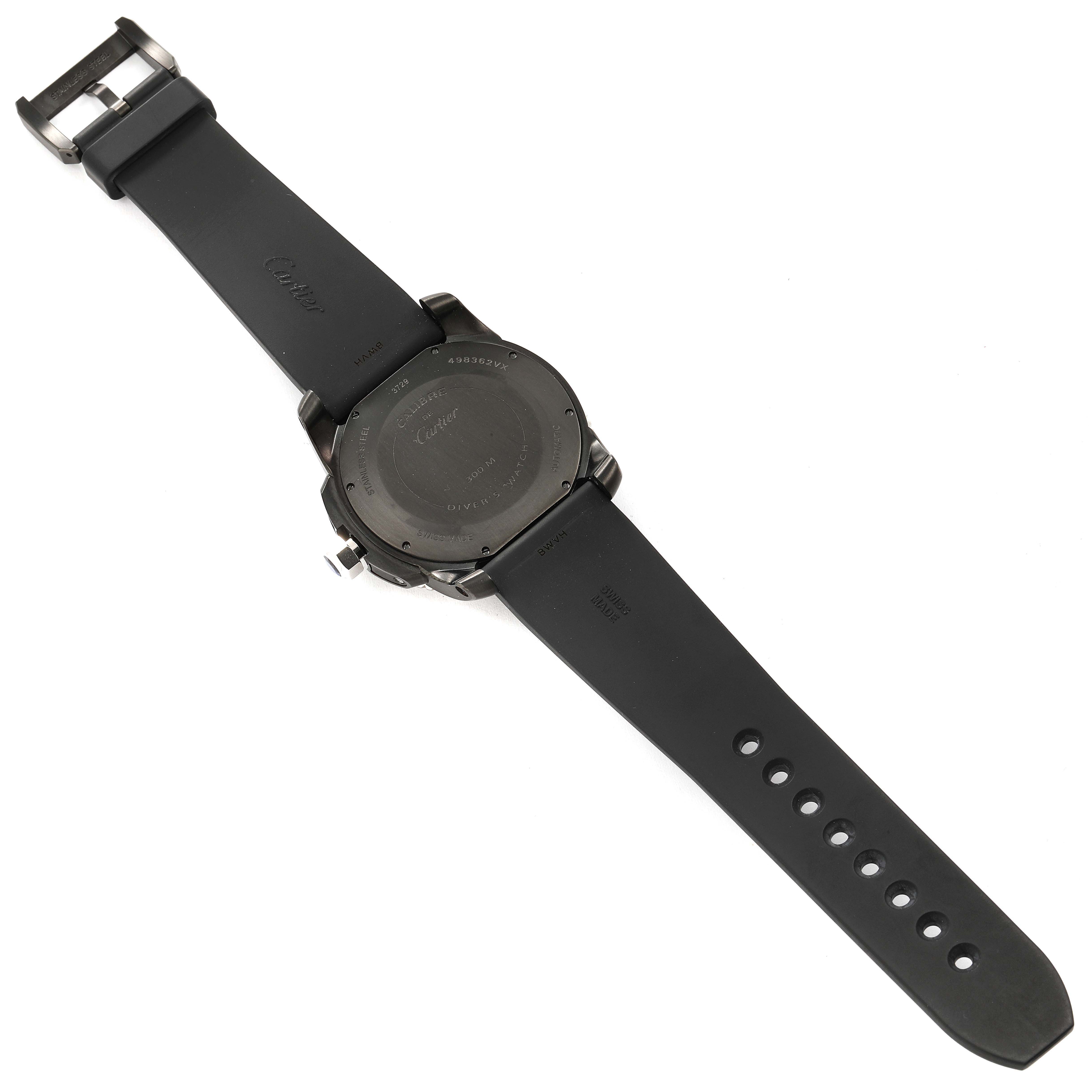 The image shows the back view of a Calibre de Cartier watch by Cartier, showcasing the case back and black strap.