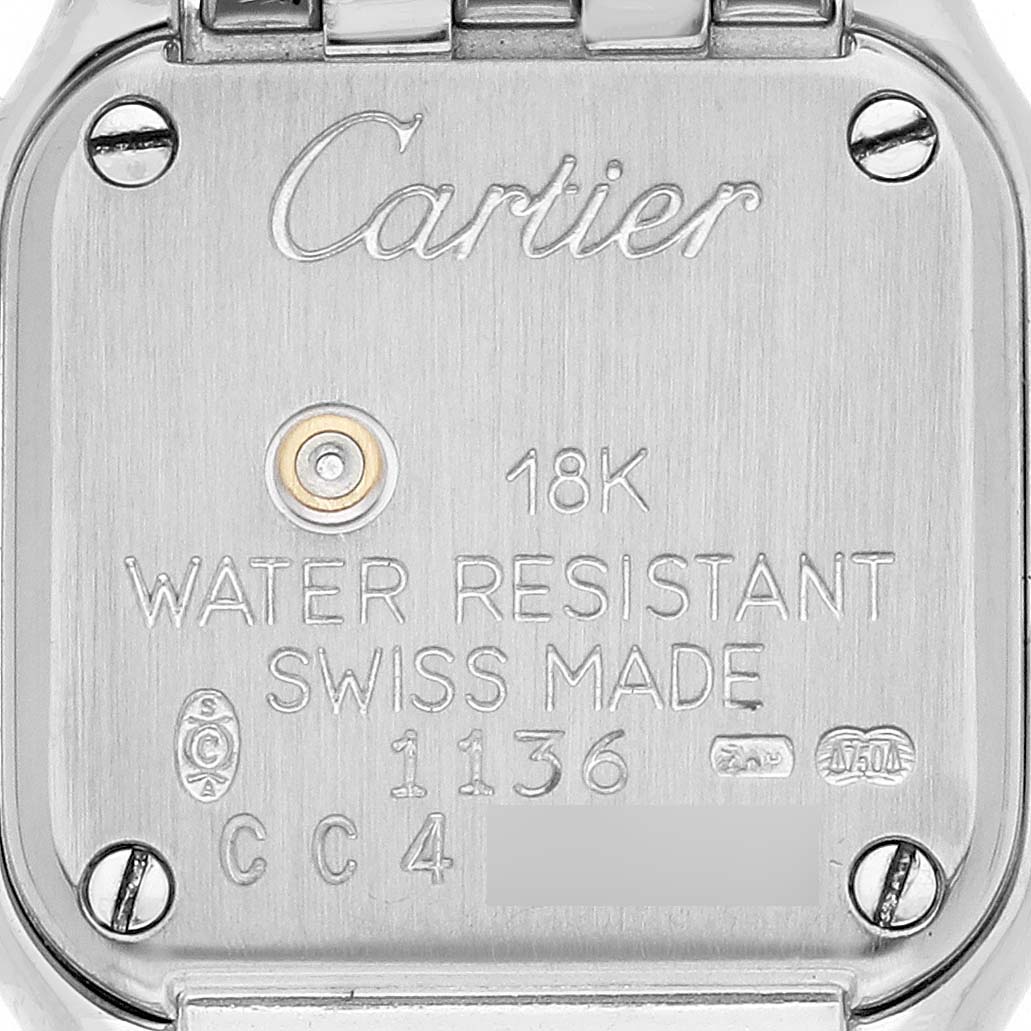 This image shows the back case of the Cartier Panthere WF3210F3 Women's White Gold Silver Dial WF3210F3 Women's White Gold Silver Dial watch, featuring inscriptions and screws.