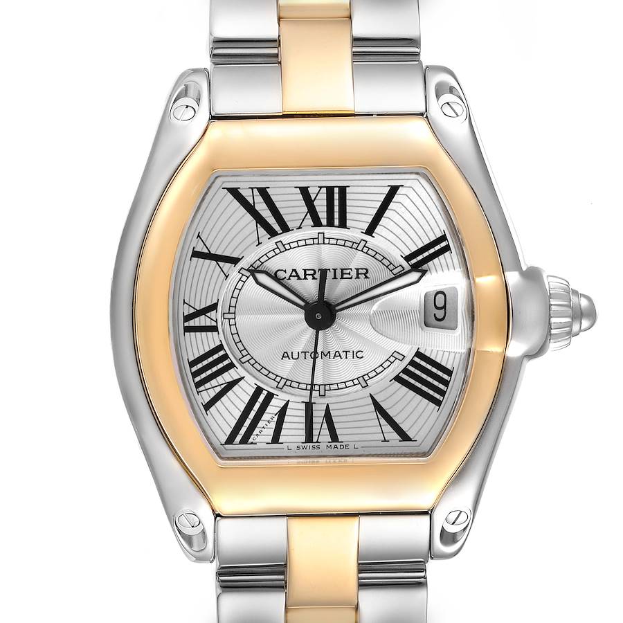 The Cartier Roadster watch is shown from a top-down angle highlighting the face, bezel, and part of the bracelet.