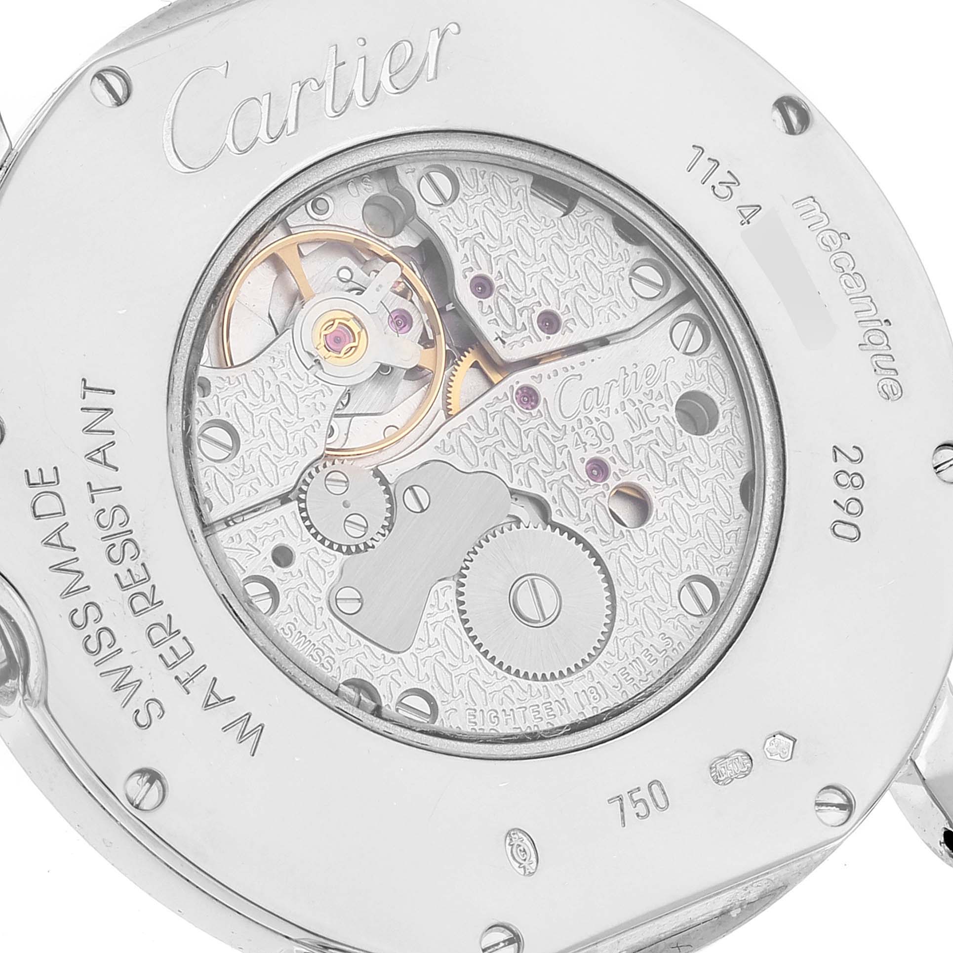 The image shows a close-up of the back case and mechanical movement of the Cartier Ronde watch.