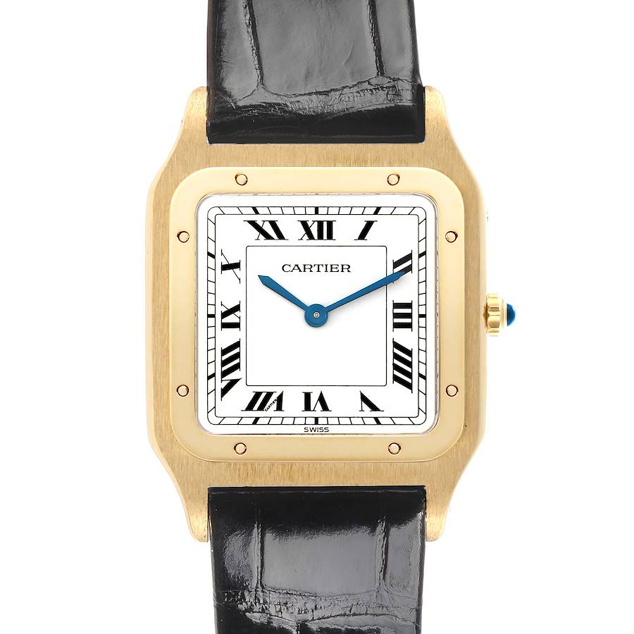 The Cartier Santos Dumont watch is shown from the front, highlighting its square gold case, Roman numeral dial, and black leather strap.