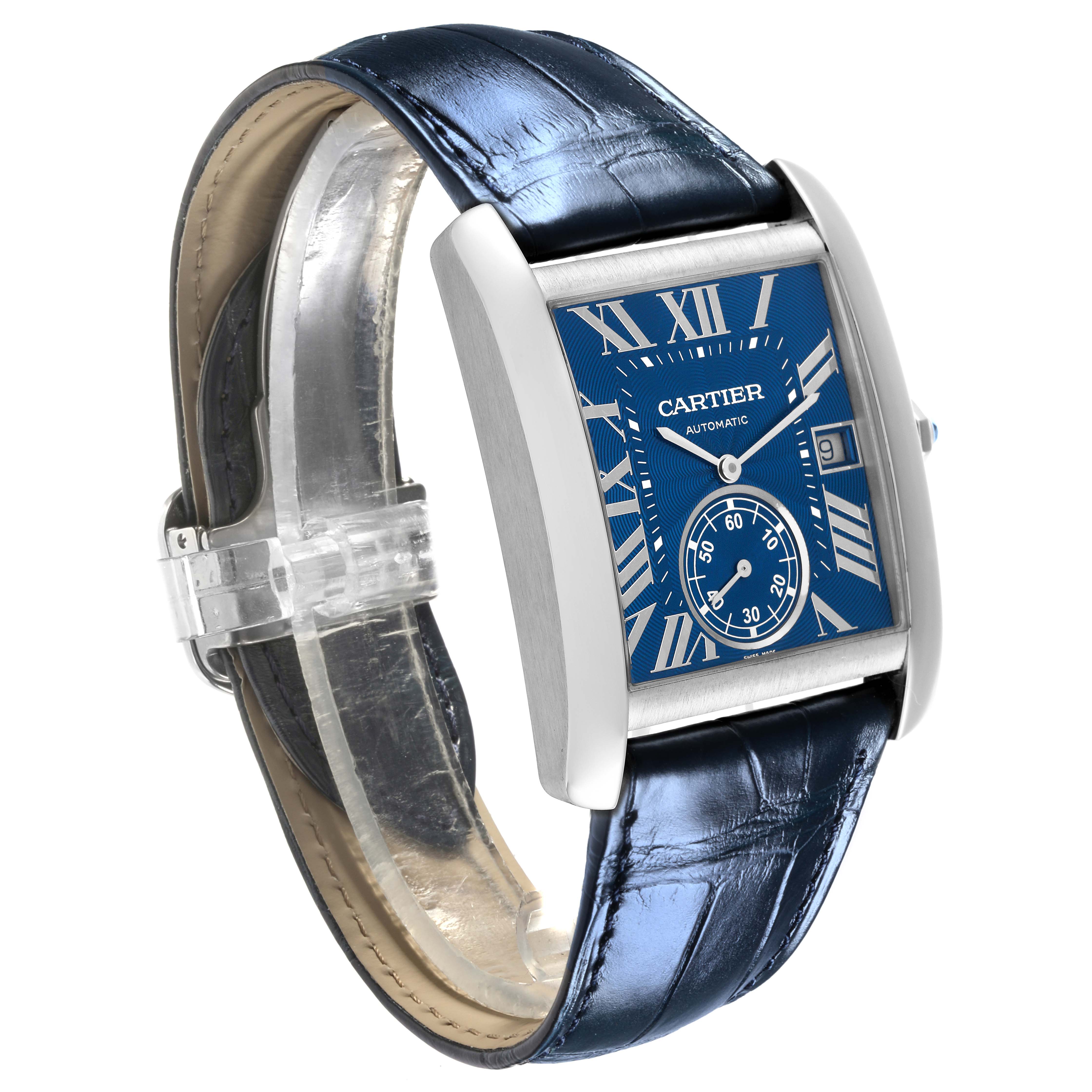 The Cartier Tank MC WSTA0010 Men's Stainless Steel Blue Dial WSTA0010 Men's Stainless Steel Blue Dial watch is shown at an angle highlighting its face, Roman numerals, date display, and leather strap.