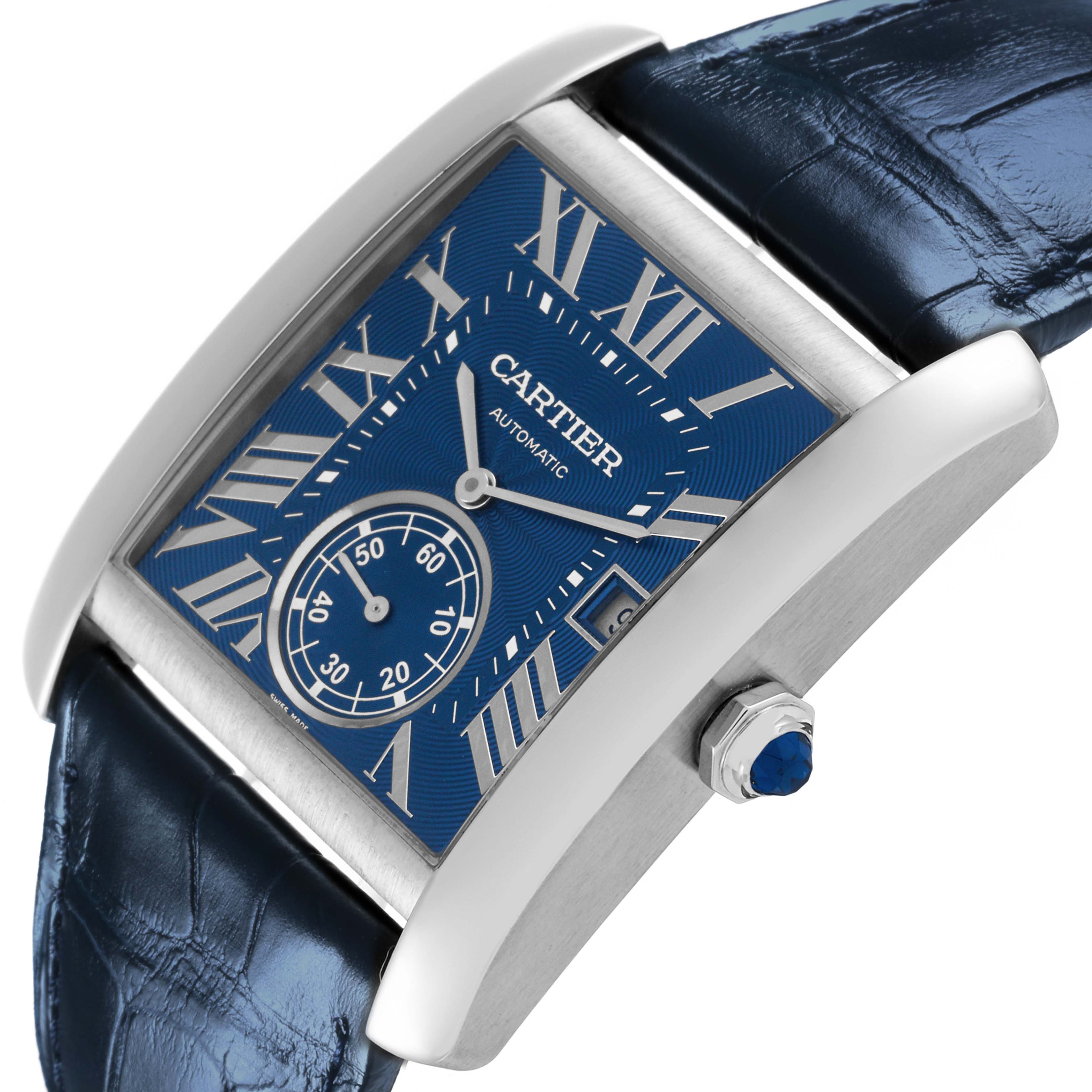 The Cartier Tank MC WSTA0010 Men's Stainless Steel Blue Dial WSTA0010 Men's Stainless Steel Blue Dial watch is shown at a slight angle, highlighting the blue dial, case, crown, and leather strap.