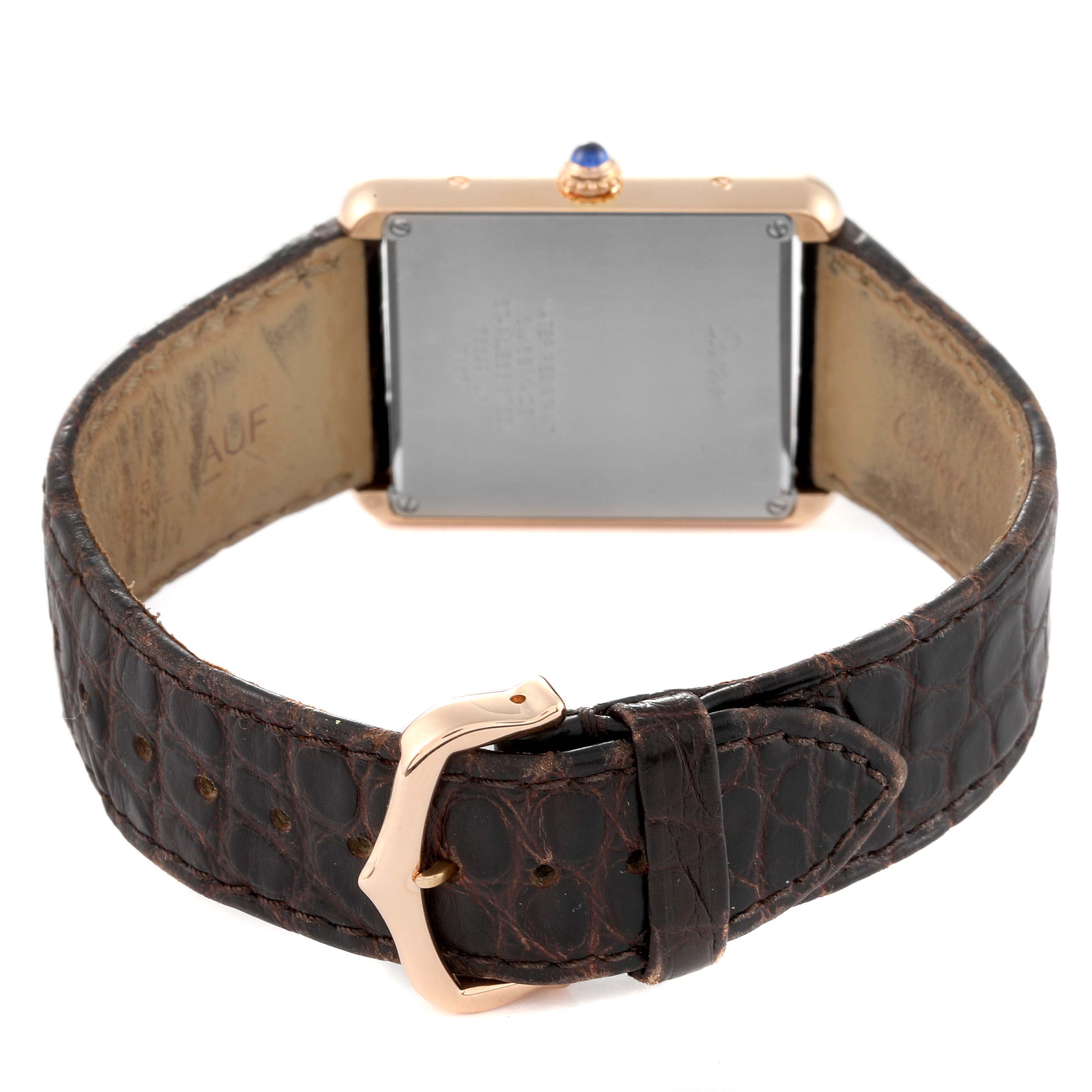 This image shows the back view of a Cartier Tank Solo W5200025 Men
s Rose Gold Silver Dial W5200025 Men
s Rose Gold Silver Dial watch, highlighting the caseback and leather strap with a buckle.
