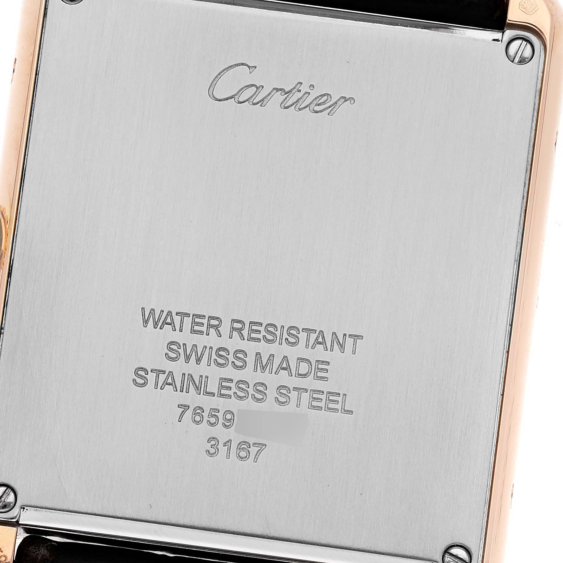 The image shows the stainless steel back casing of a Tank Solo watch by Cartier at an angled close-up.