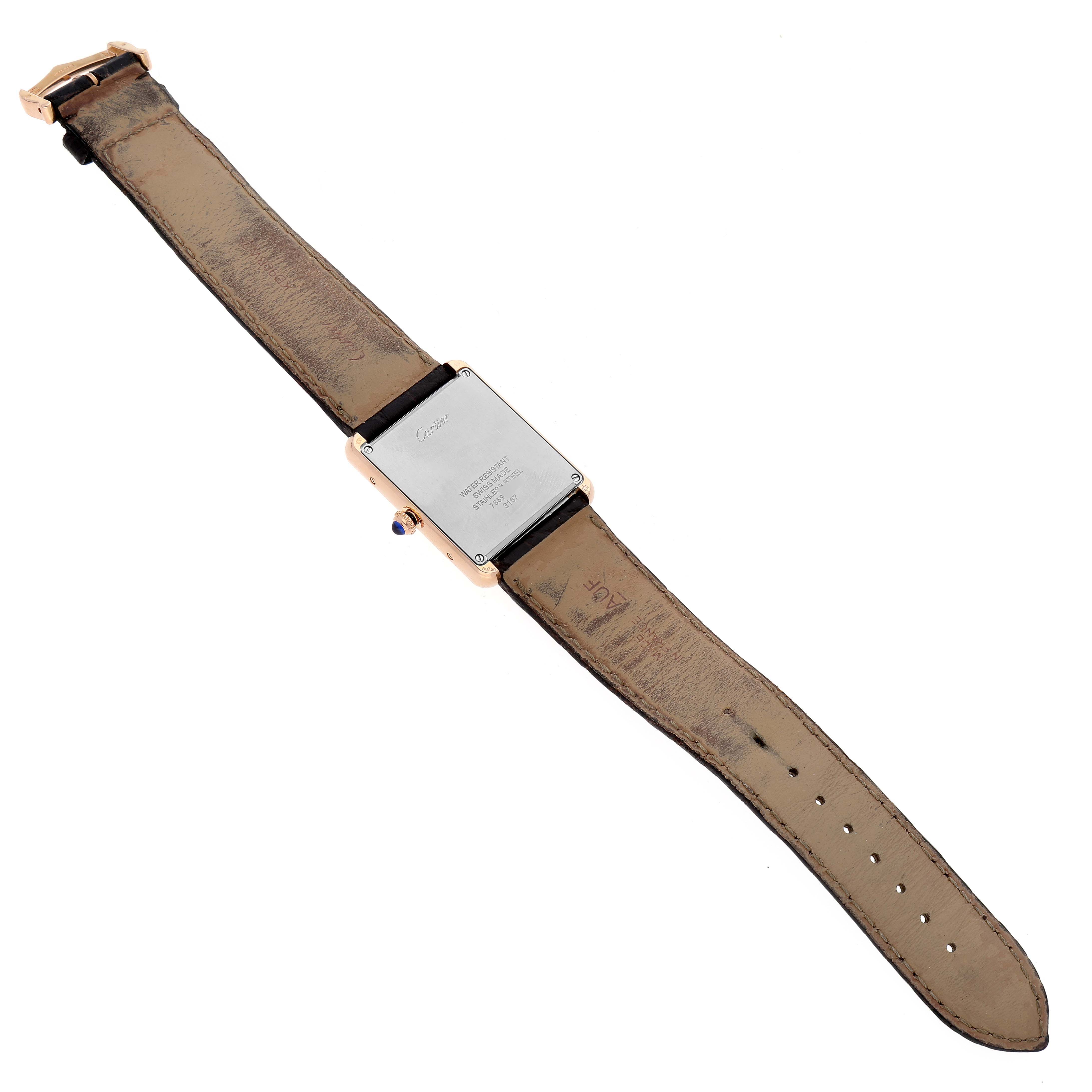 The image shows the back view of a Cartier Tank Solo W5200025 Men
s Rose Gold Silver Dial W5200025 Men
s Rose Gold Silver Dial watch, displaying the case back and leather strap.