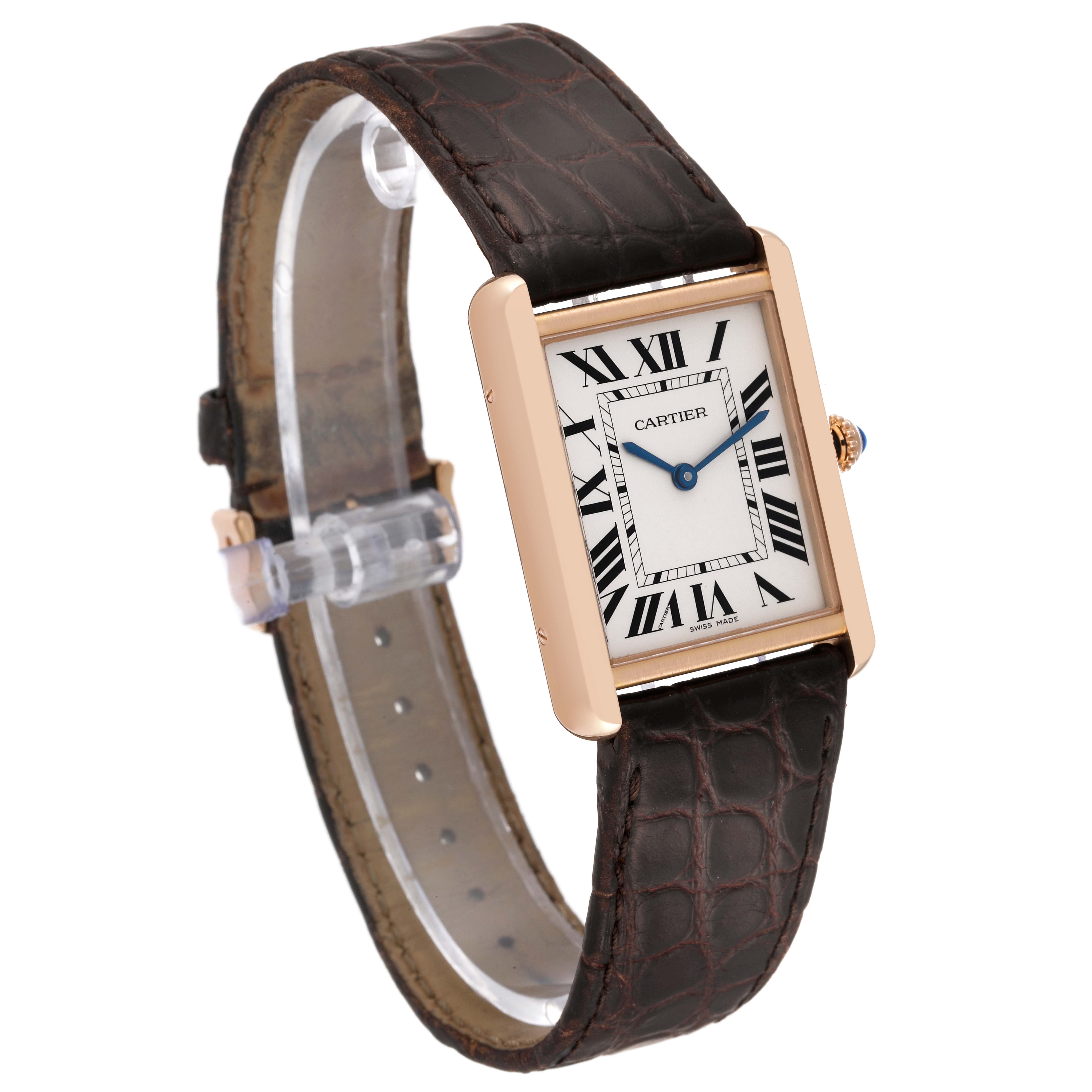 The image shows a Cartier Tank Solo W5200025 Men
s Rose Gold Silver Dial W5200025 Men
s Rose Gold Silver Dial watch, featuring its rectangular face, blue hands, Roman numerals, and leather strap at a 3/4 angle.