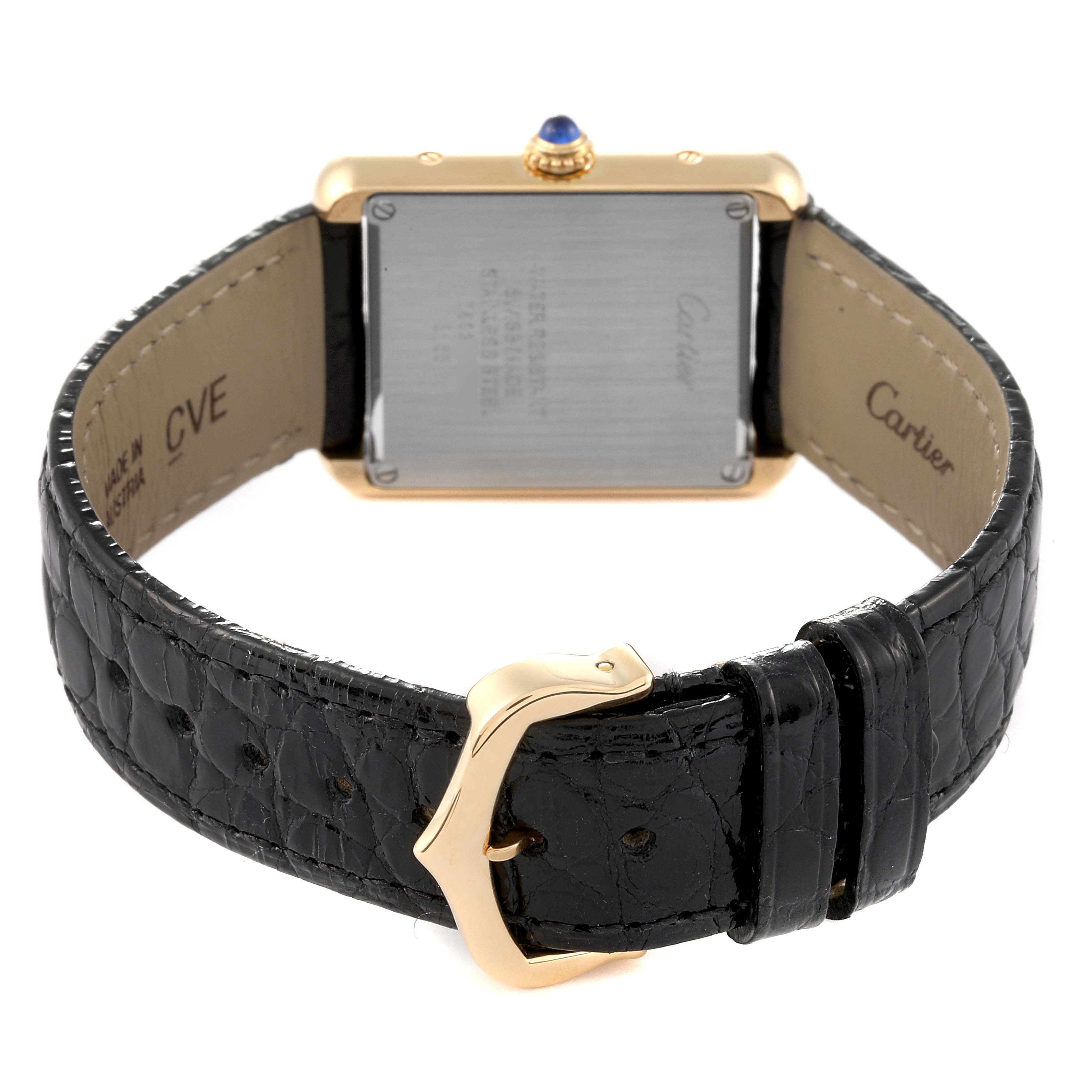 The image shows a rear view of a Cartier Tank Solo W5200002 Women's Yellow Gold Silver Dial W5200002 Women's Yellow Gold Silver Dial watch, highlighting the back case and black leather strap with a gold buckle.