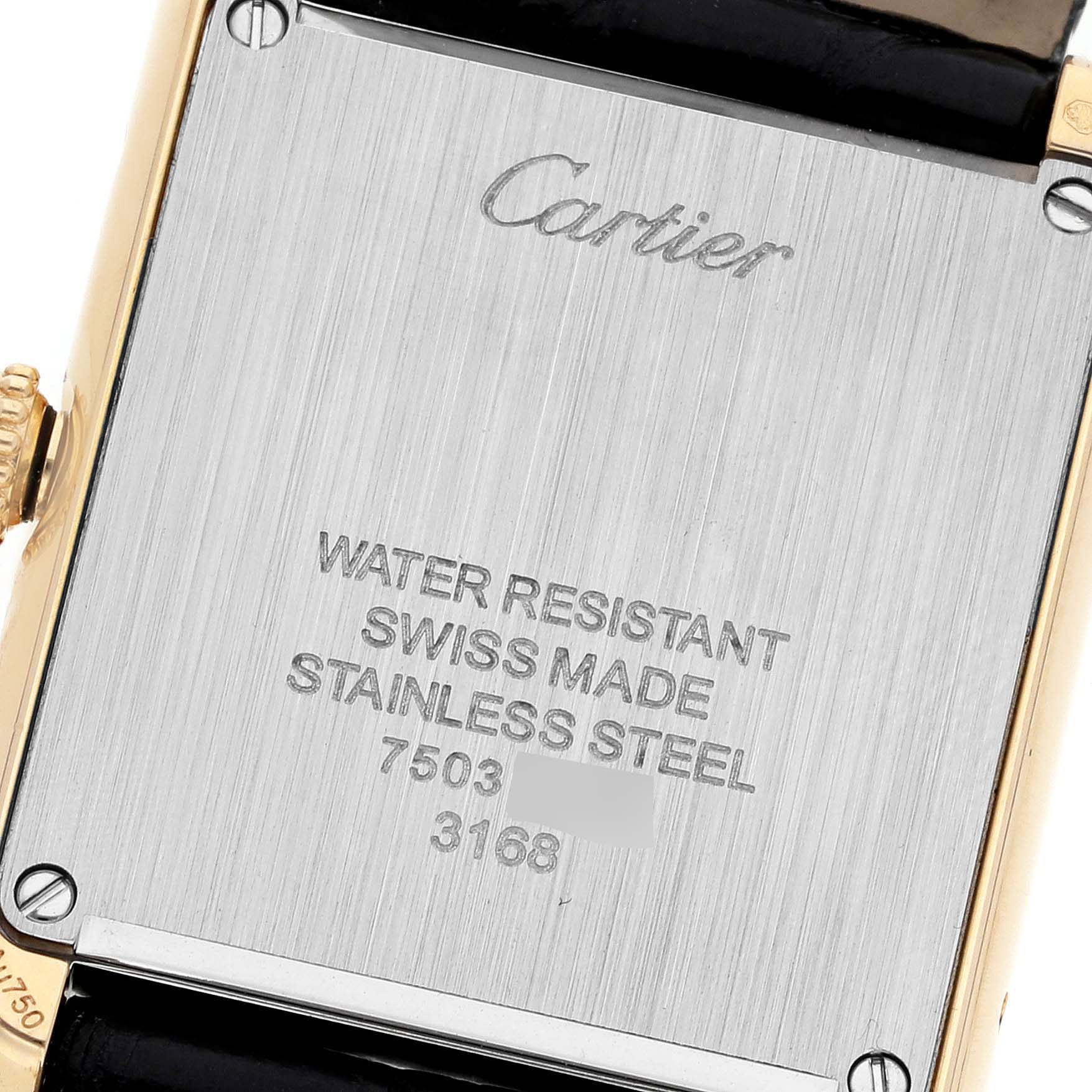 This image shows the back case of a Cartier Tank Solo W5200002 Women's Yellow Gold Silver Dial W5200002 Women's Yellow Gold Silver Dial watch, highlighting its engravings and materials.