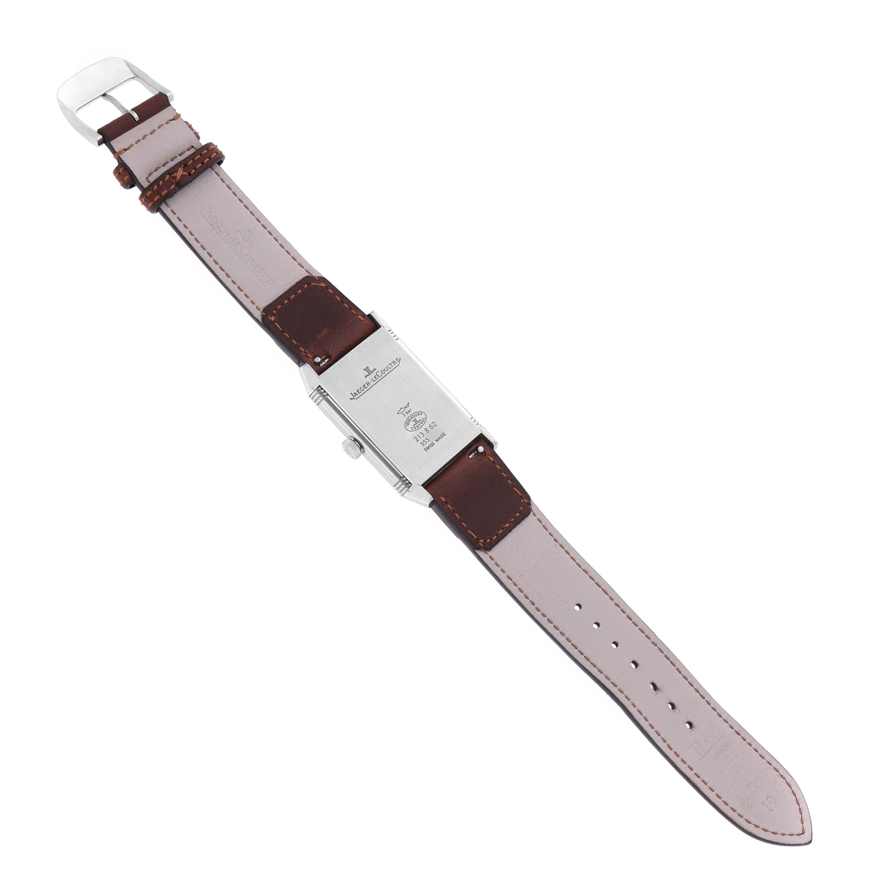 The Reverso model by Jaeger LeCoultre is shown from the back, displaying the case back and leather strap.