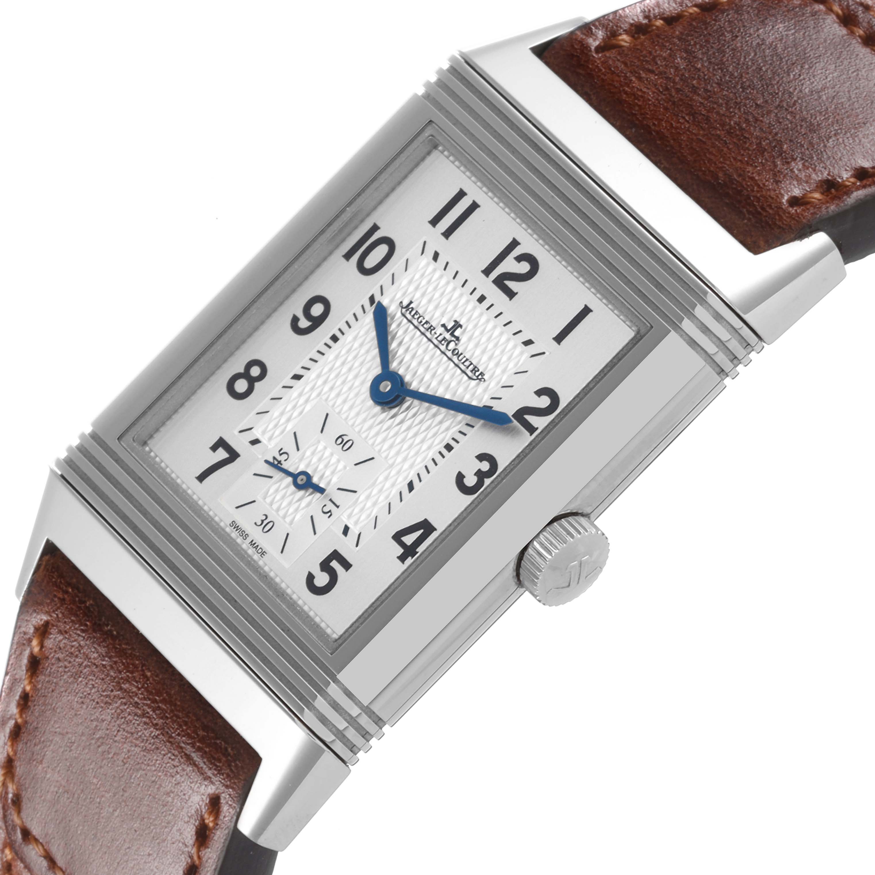 The Jaeger LeCoultre Reverso Q2438522 Men's Stainless Steel Silver Dial Q2438522 Men's Stainless Steel Silver Dial watch is shown at an angle displaying its rectangular face, crown, and brown leather strap.