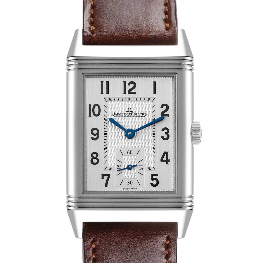 The Jaeger-LeCoultre Reverso watch is shown from the front, displaying its face, crown, and brown leather strap.