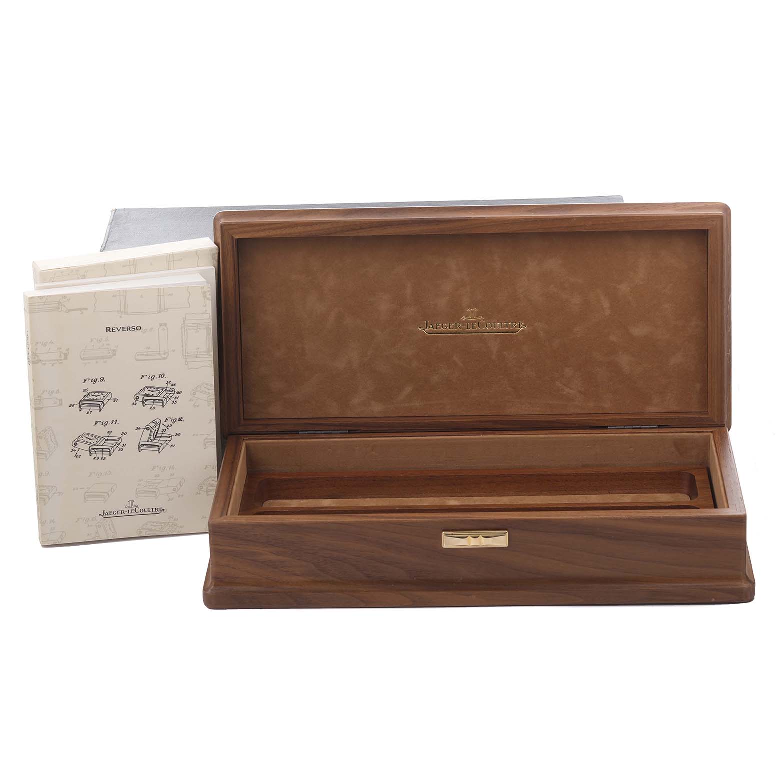 The image shows a Jaeger-LeCoultre Reverso watch box and accompanying manuals from a front angle.